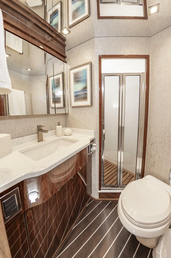 a bathroom with a sink and a toilet aboard MERCENARIA Yacht for Sale