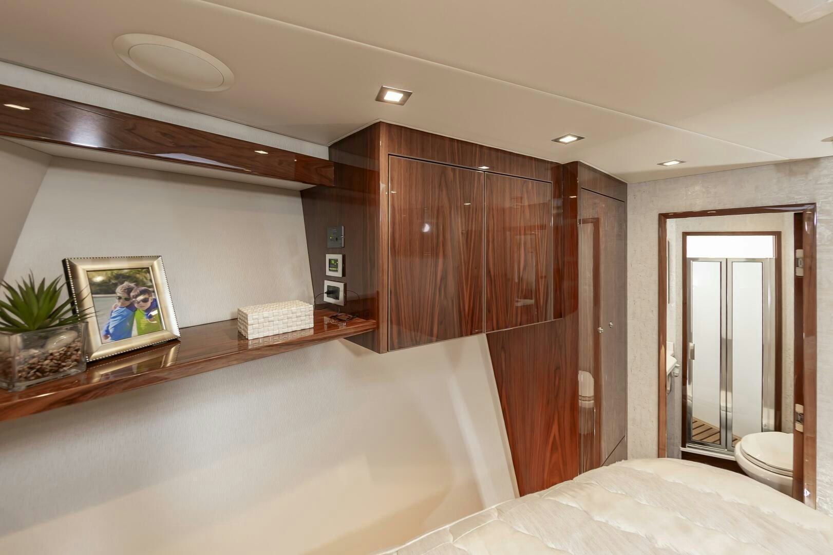 a room with a bed and a desk aboard MERCENARIA Yacht for Sale