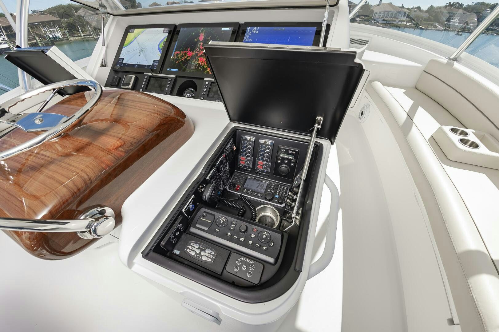 a black rectangular object with a screen and buttons on a car dashboard aboard MERCENARIA Yacht for Sale