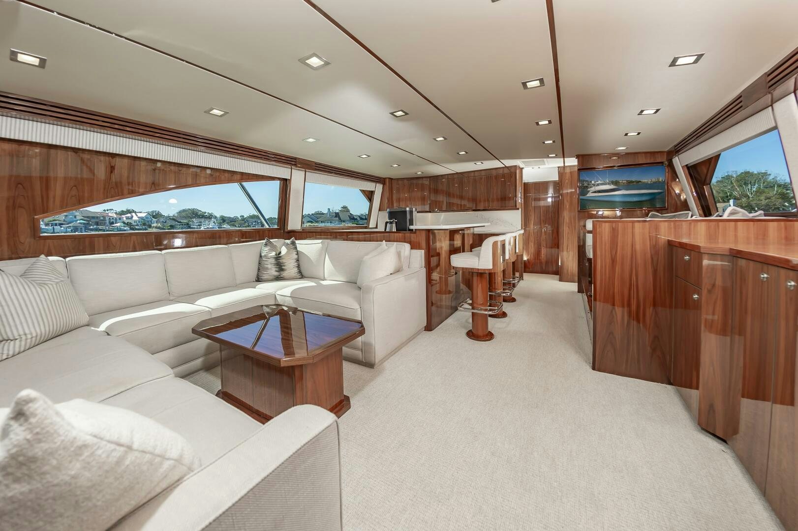 a living room with a couch and a table aboard MERCENARIA Yacht for Sale
