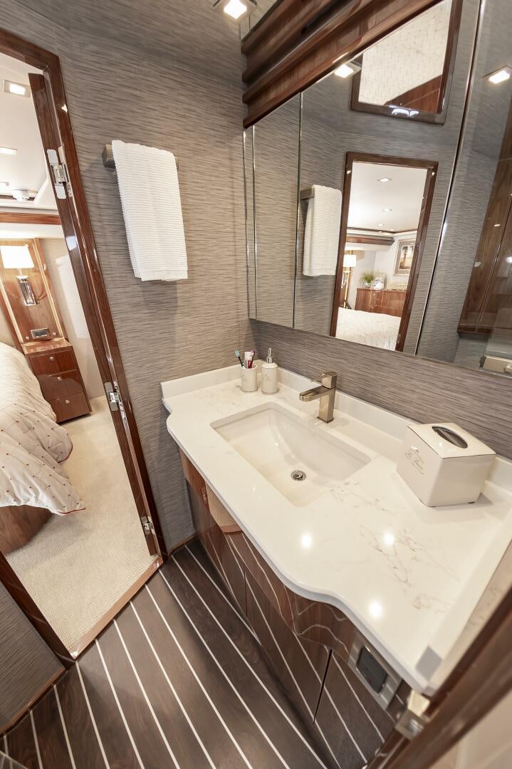 a bathroom with a sink and a mirror aboard MERCENARIA Yacht for Sale