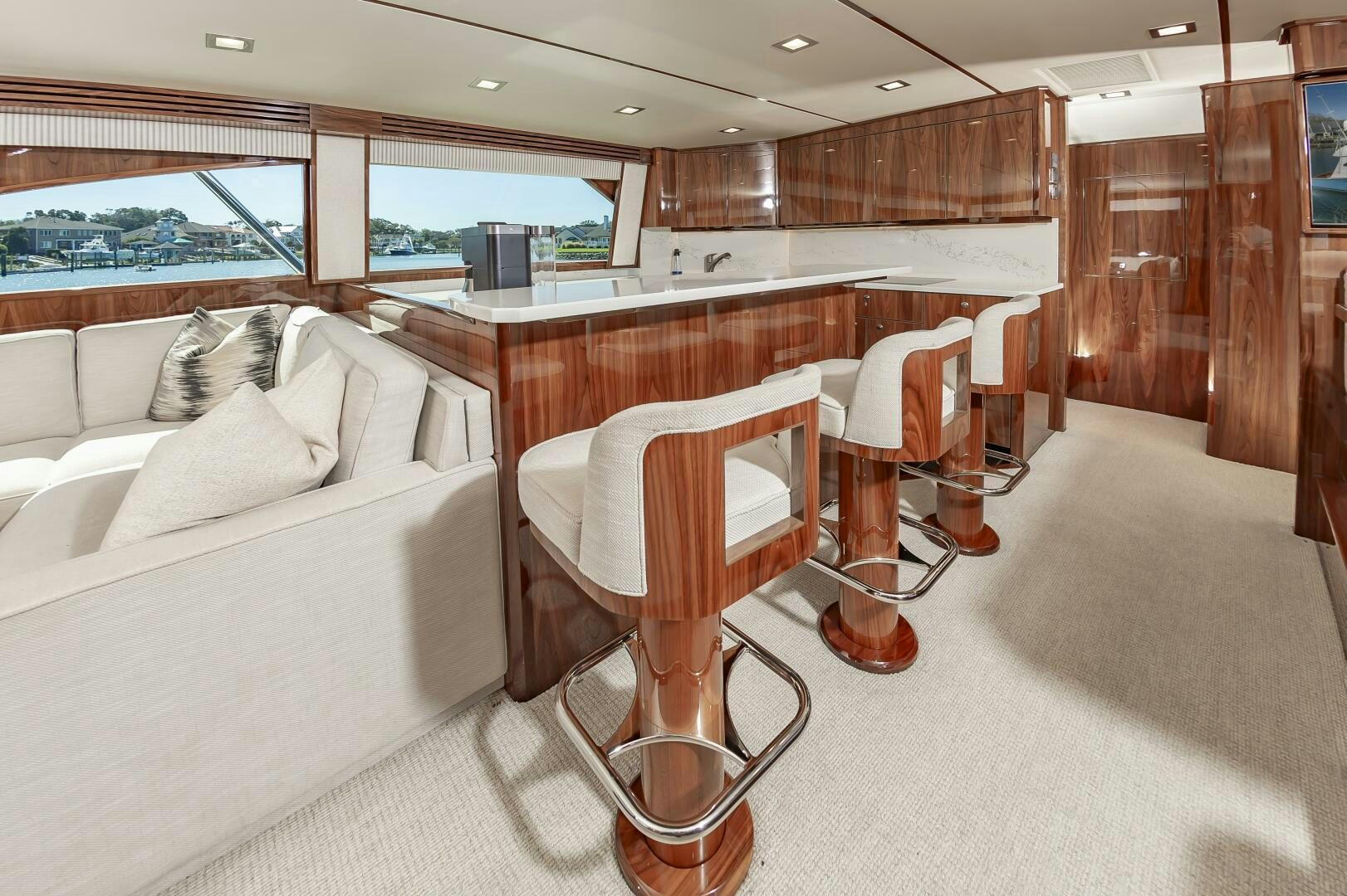 a room with a couch and a chair aboard MERCENARIA Yacht for Sale