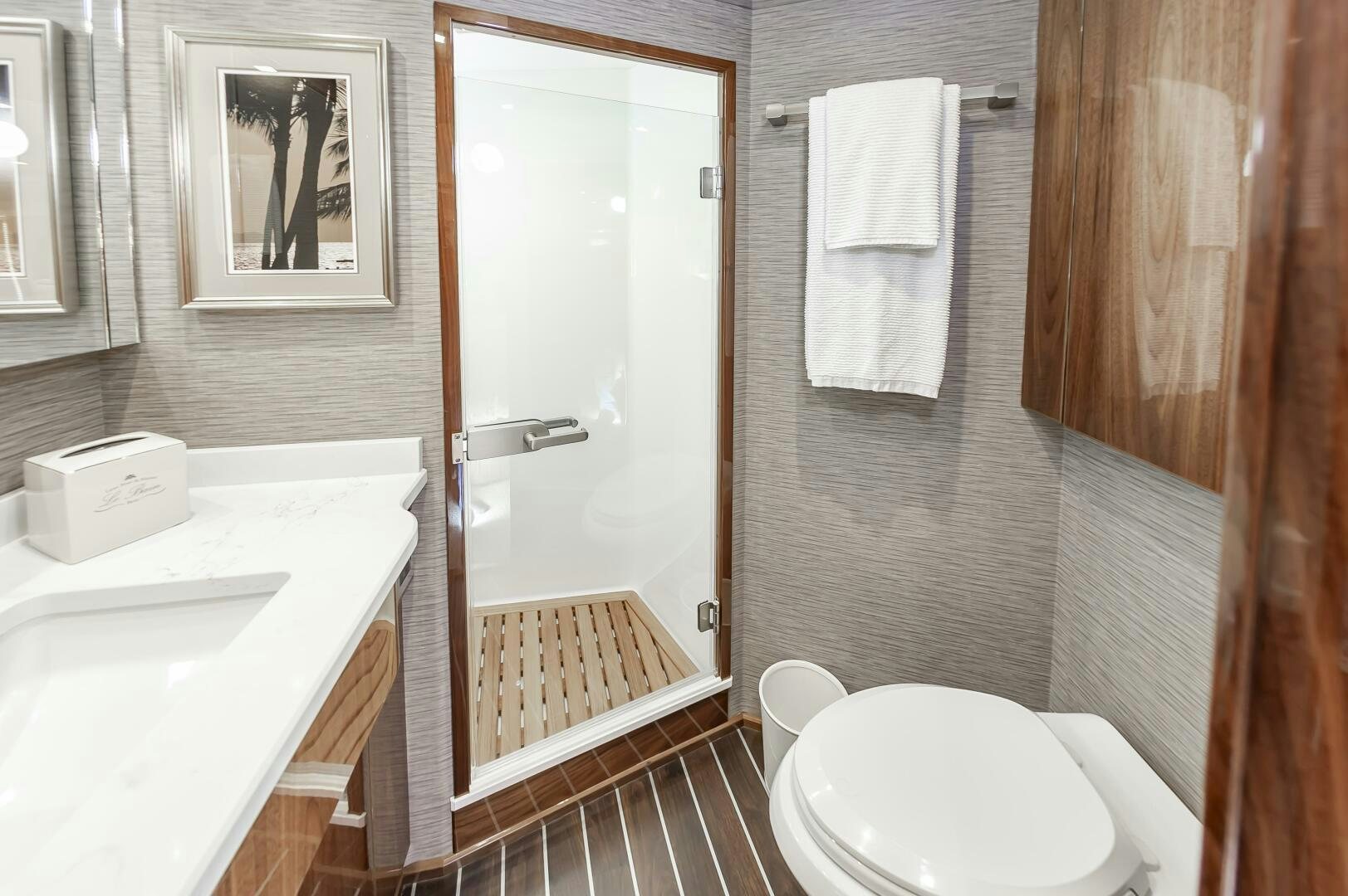a bathroom with a sink toilet and a shower unit aboard MERCENARIA Yacht for Sale