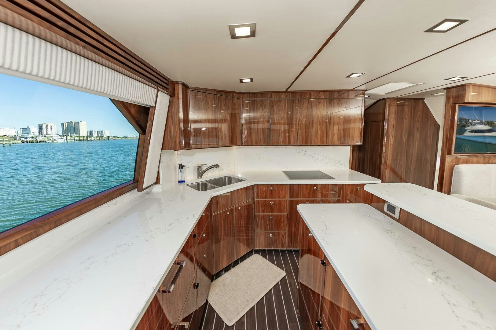 a large kitchen with a large window aboard MERCENARIA Yacht for Sale