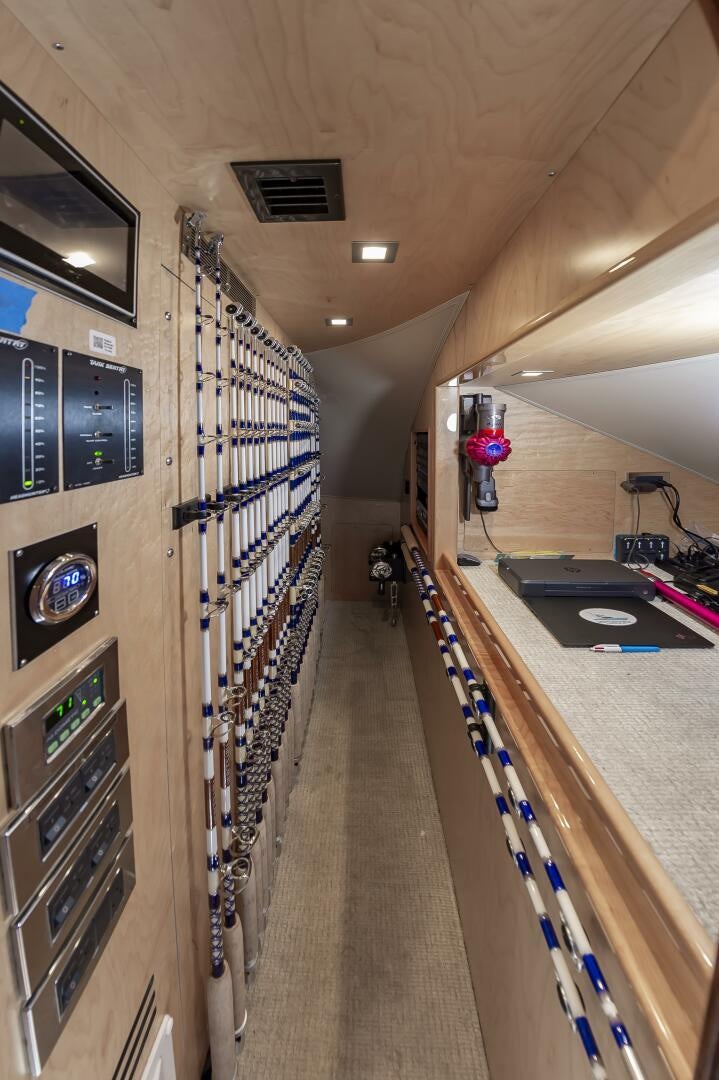 a long hallway with a few machines aboard MERCENARIA Yacht for Sale