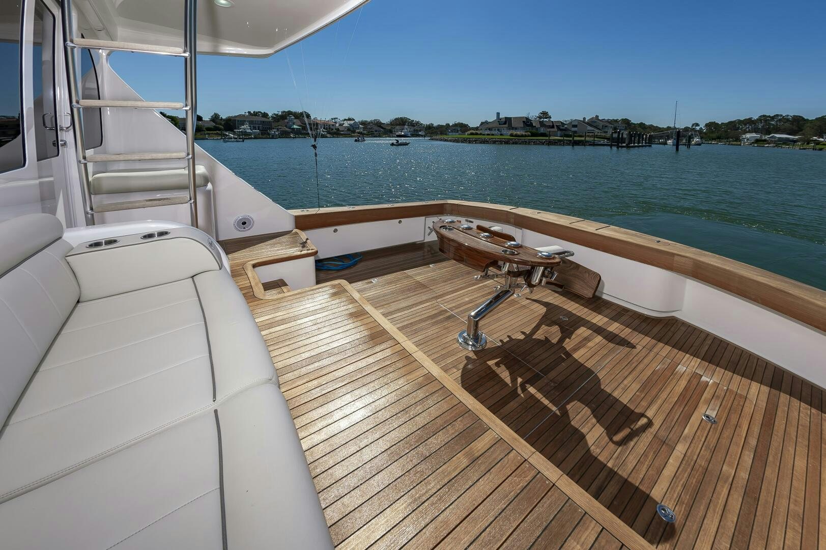 a deck with a view of the water and boats on it aboard MERCENARIA Yacht for Sale