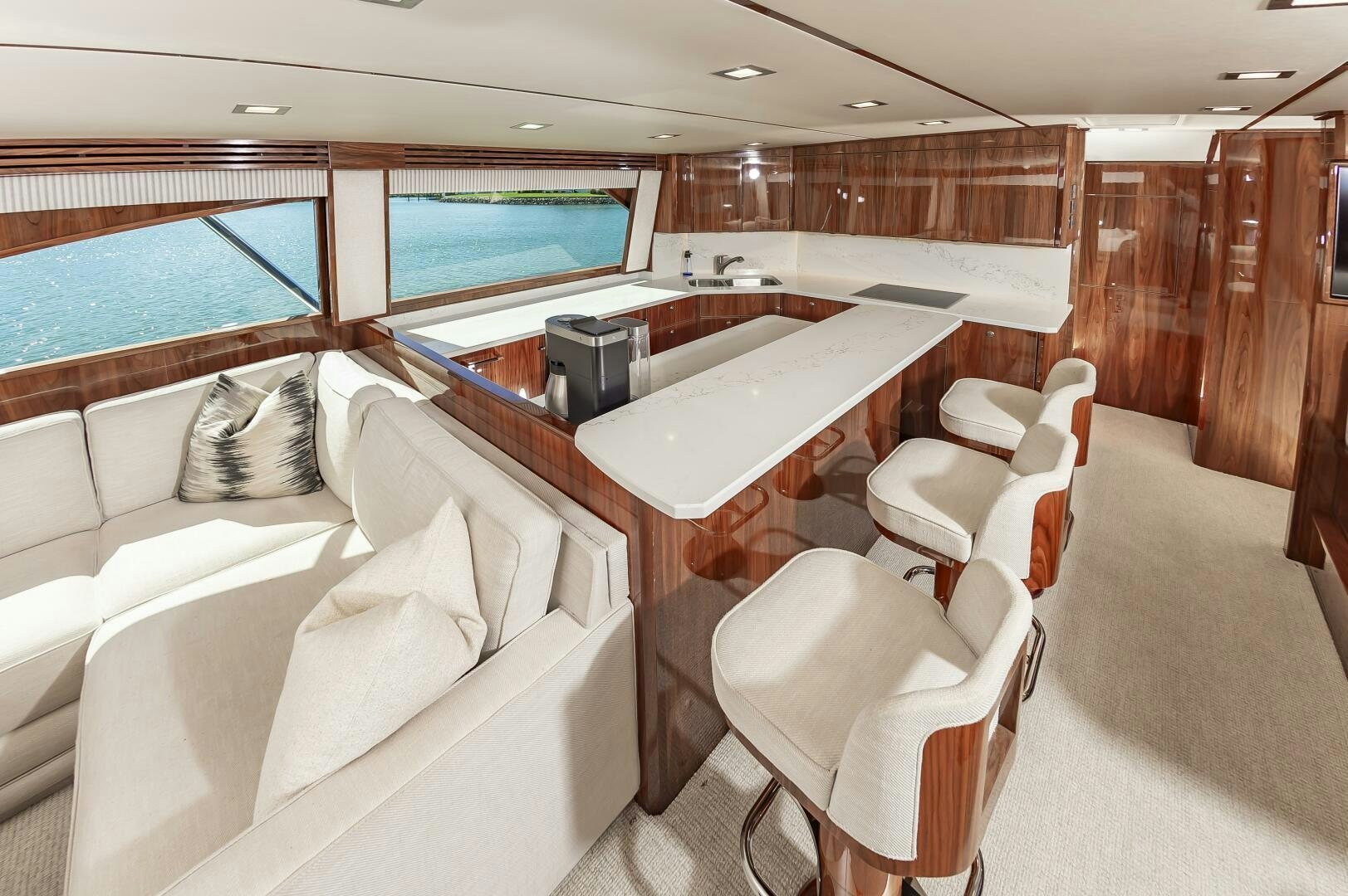 a room with a bed and a table aboard MERCENARIA Yacht for Sale