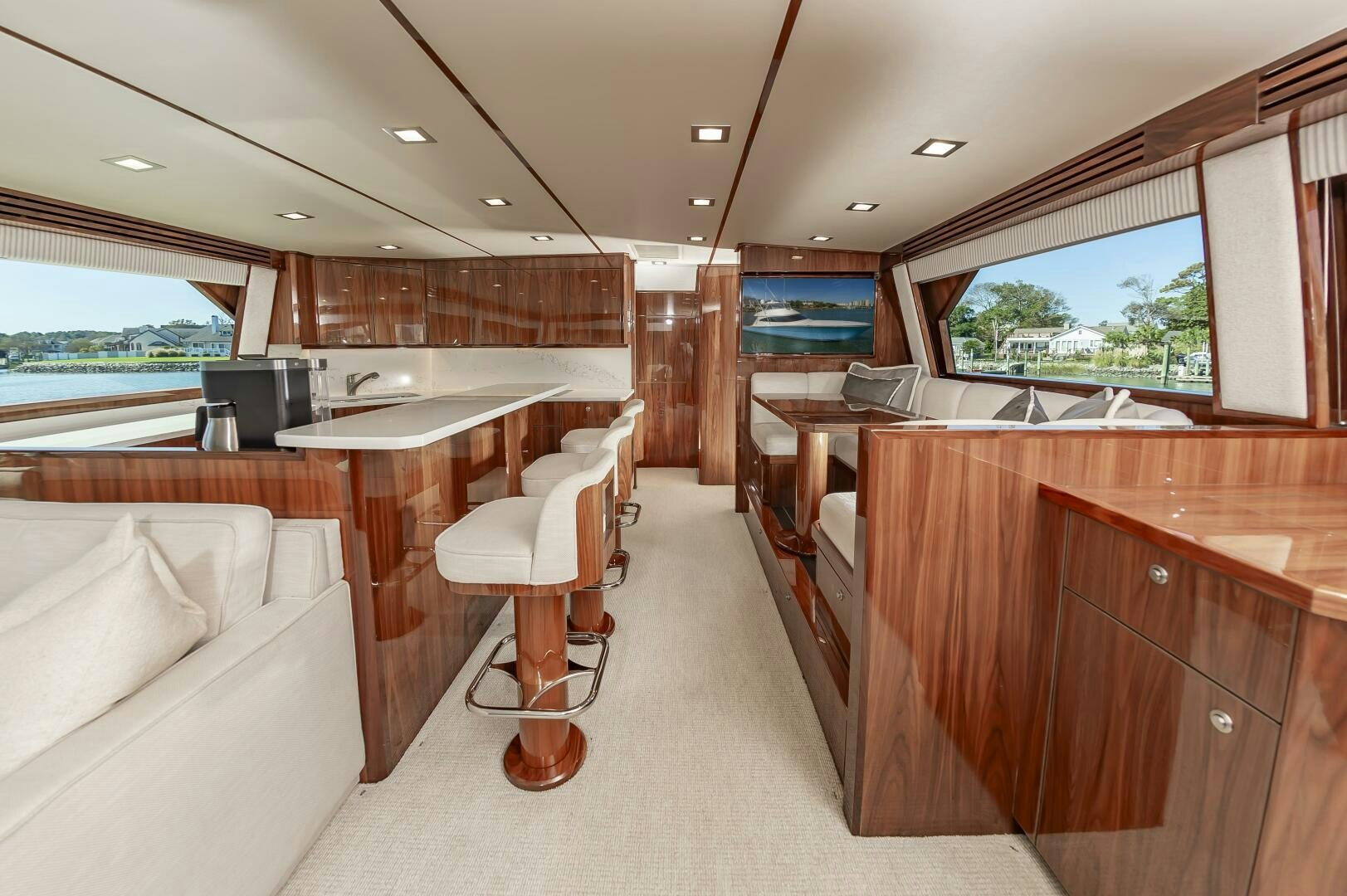 a room with a couch and a table and chairs aboard MERCENARIA Yacht for Sale