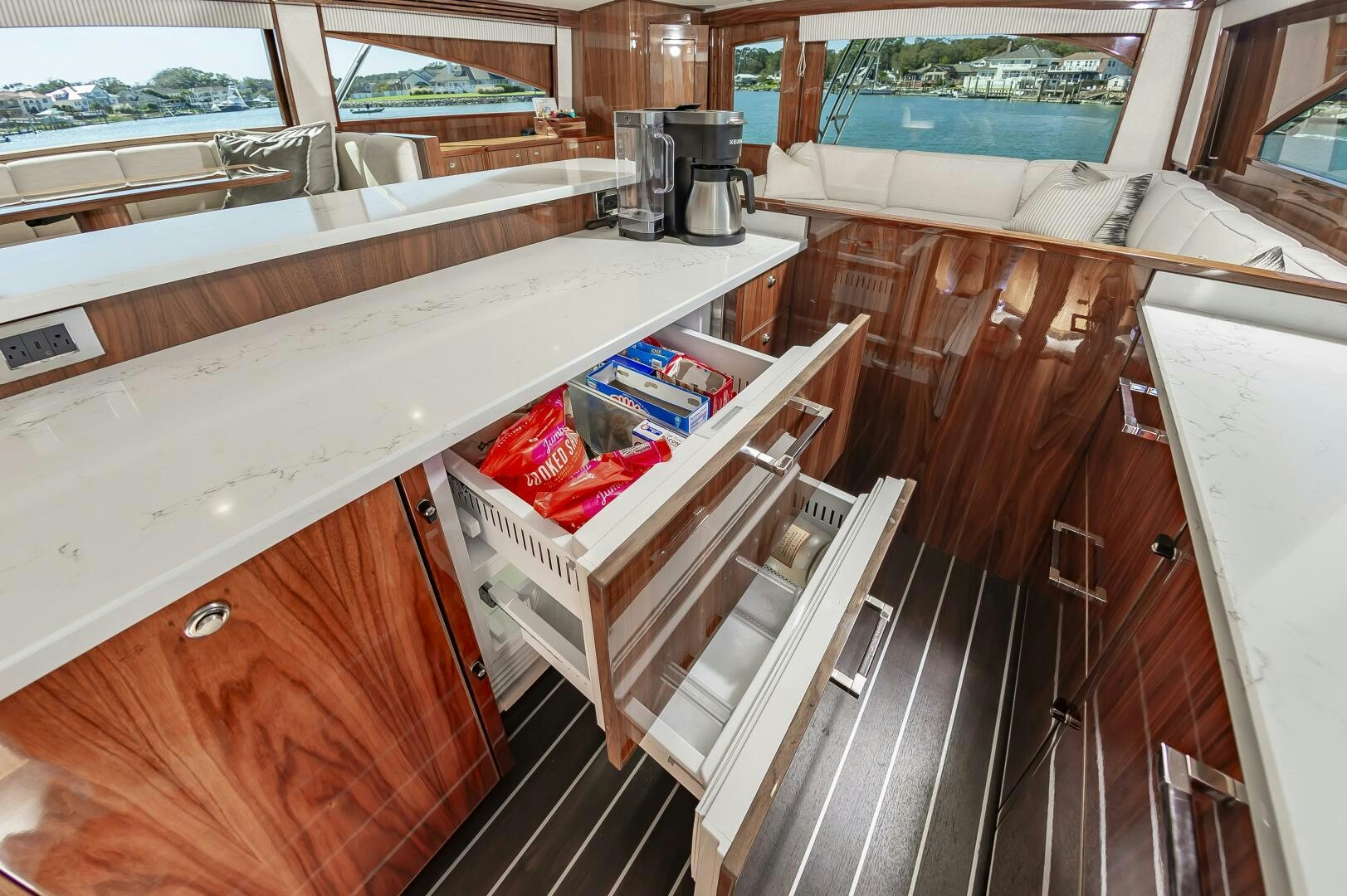 a kitchen with a large island aboard MERCENARIA Yacht for Sale