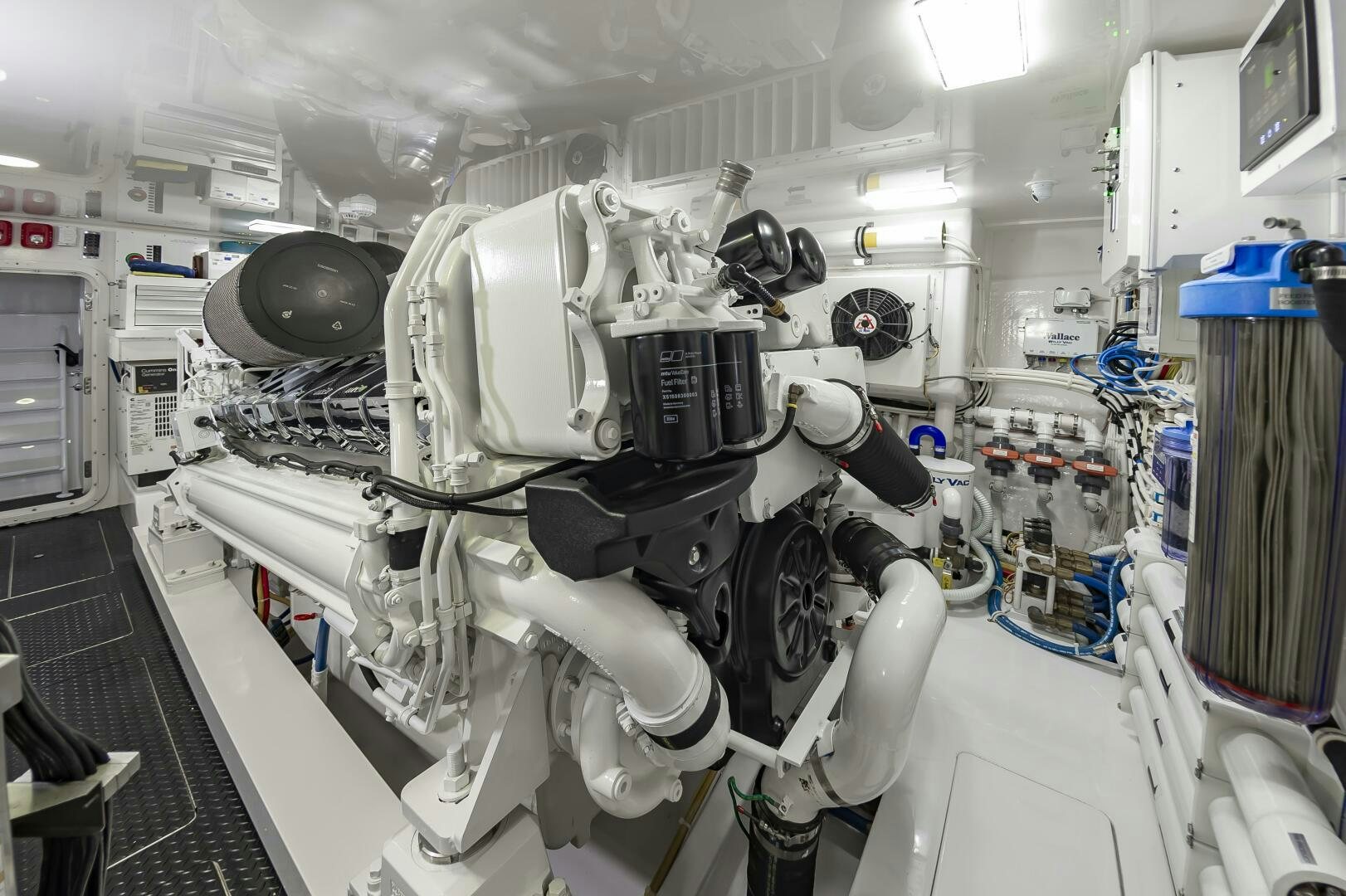 a white car with a large engine aboard MERCENARIA Yacht for Sale