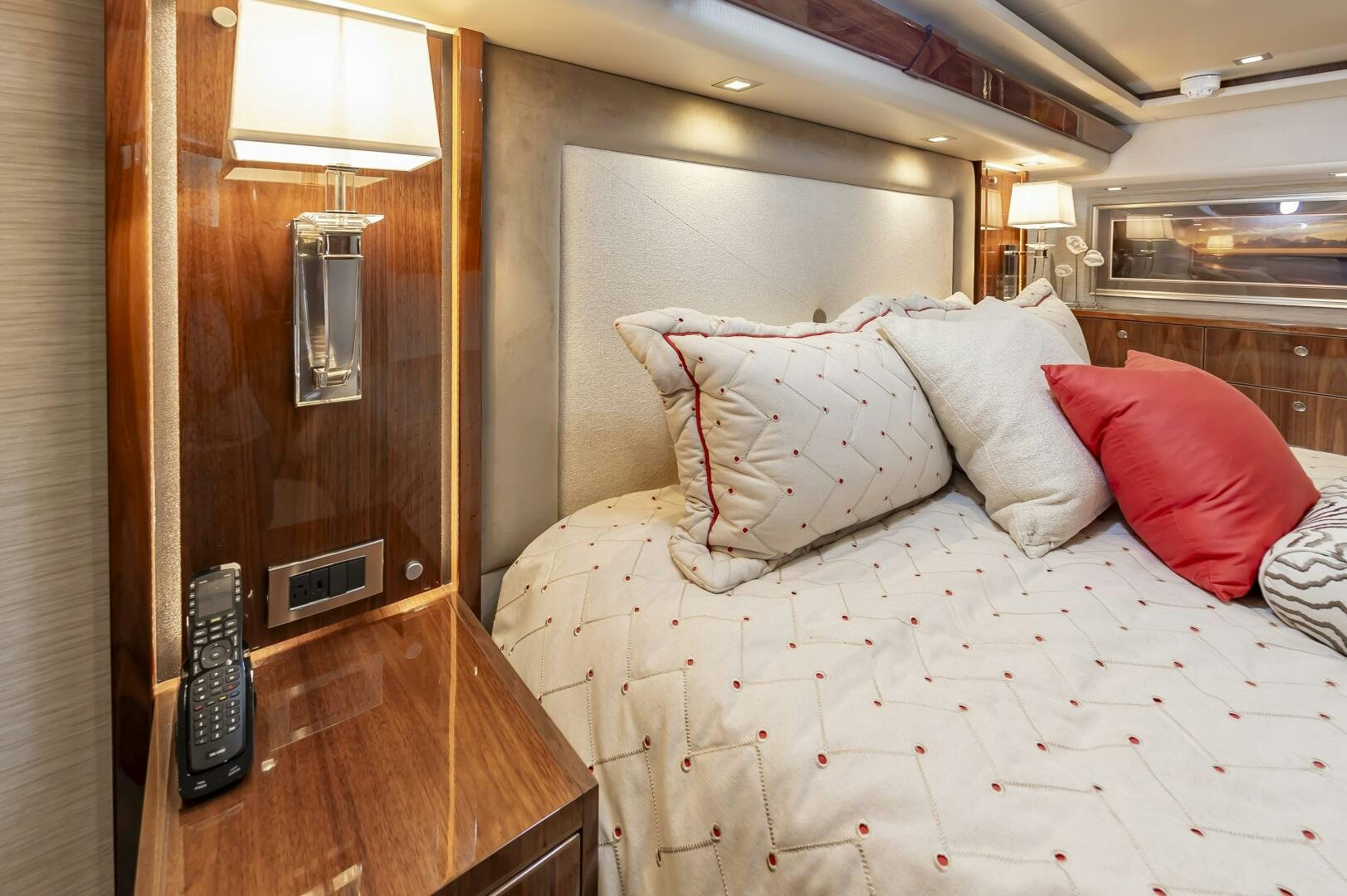 a bed with a phone on it aboard MERCENARIA Yacht for Sale