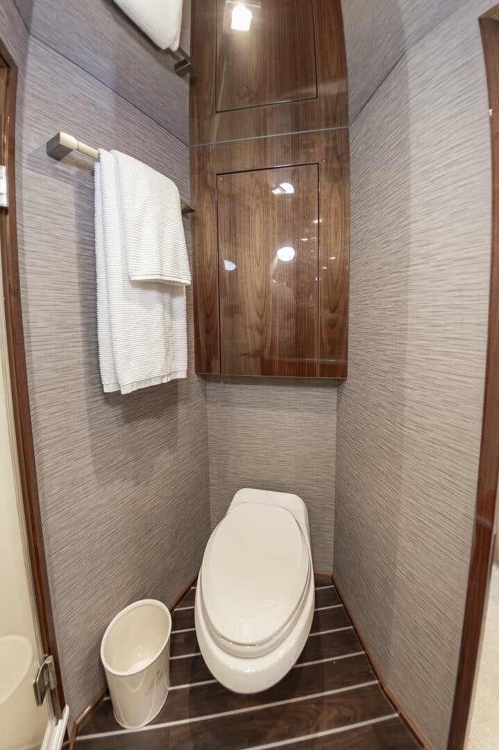 a bathroom with a toilet and a sink aboard MERCENARIA Yacht for Sale