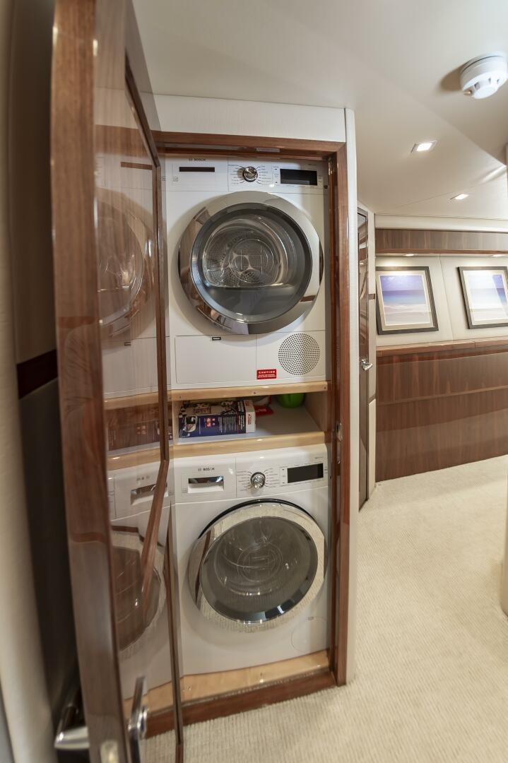 a washer and dryer in a room aboard MERCENARIA Yacht for Sale
