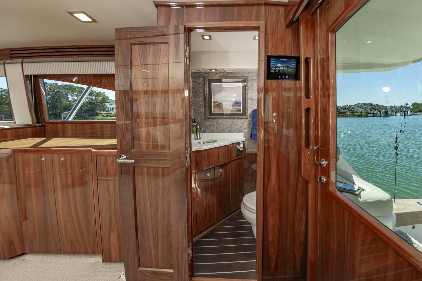 a bathroom with wood cabinets aboard MERCENARIA Yacht for Sale