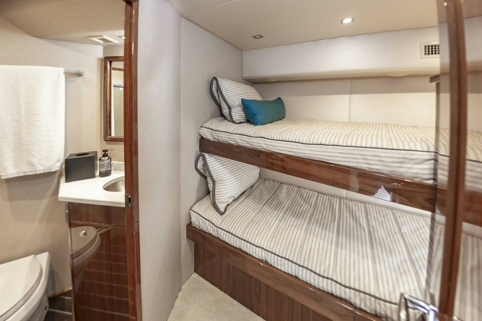 a small bedroom with a bunk bed aboard MERCENARIA Yacht for Sale