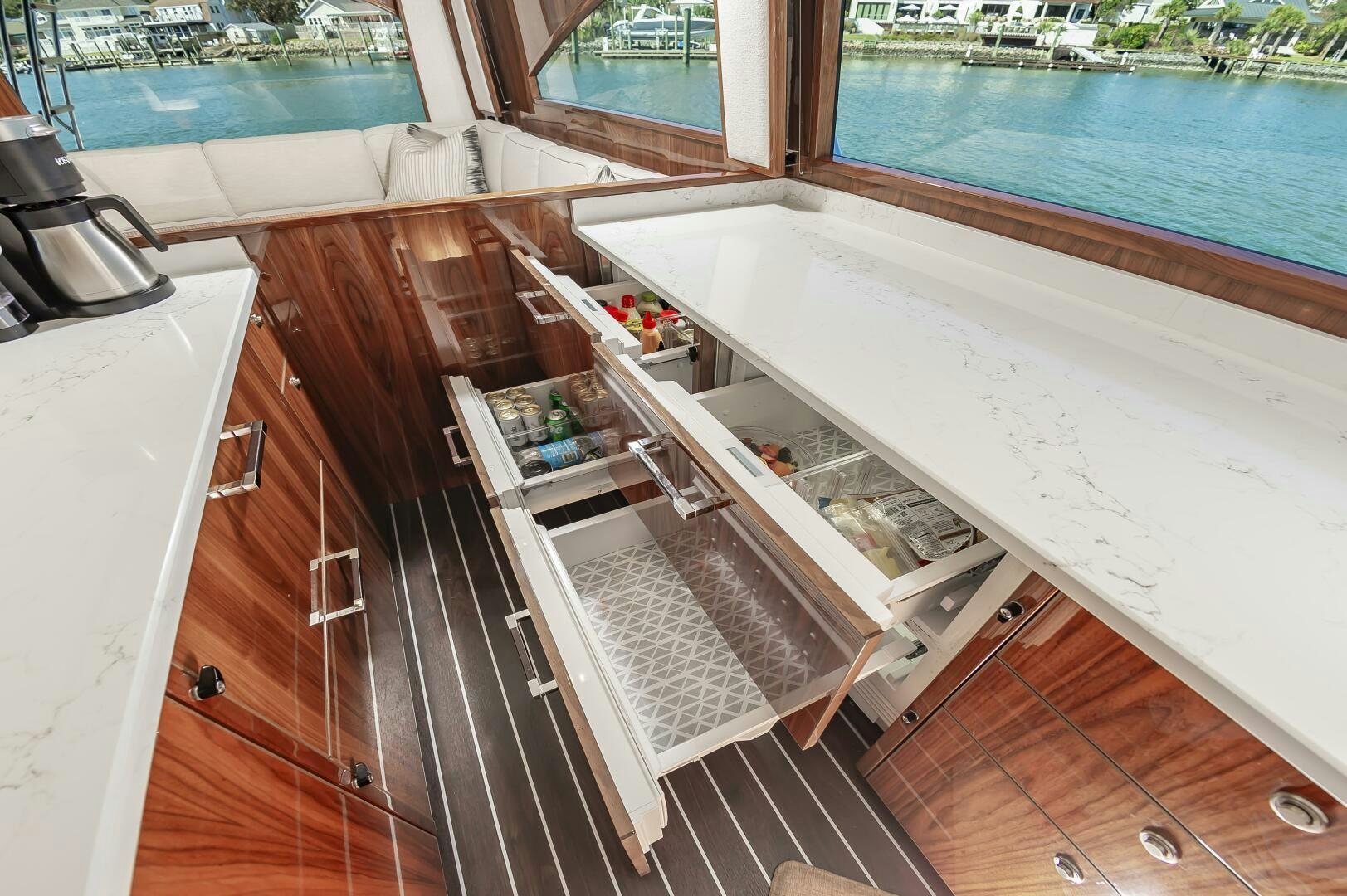 a kitchen with a large window aboard MERCENARIA Yacht for Sale