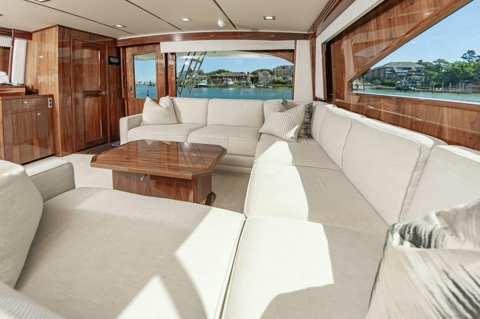a living room with a couch and a table aboard MERCENARIA Yacht for Sale