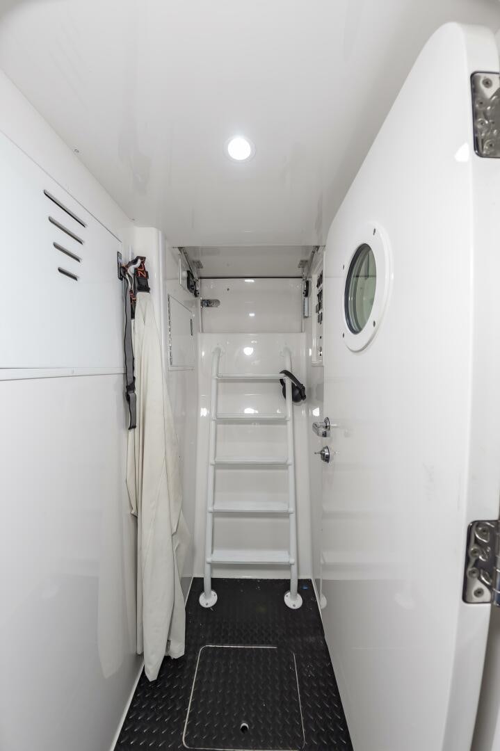 a hallway with a ladder and a ladder aboard MERCENARIA Yacht for Sale