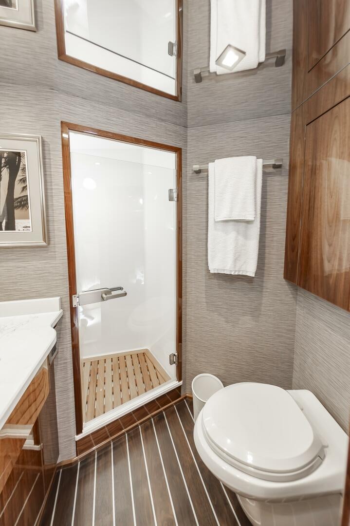 a bathroom with a toilet and a sink aboard MERCENARIA Yacht for Sale
