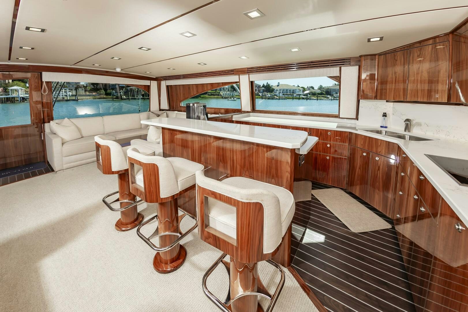 a room with a table chairs and a sink aboard MERCENARIA Yacht for Sale