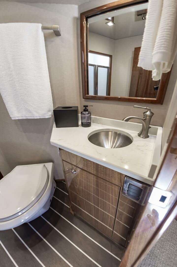 a bathroom with a sink and a toilet aboard MERCENARIA Yacht for Sale