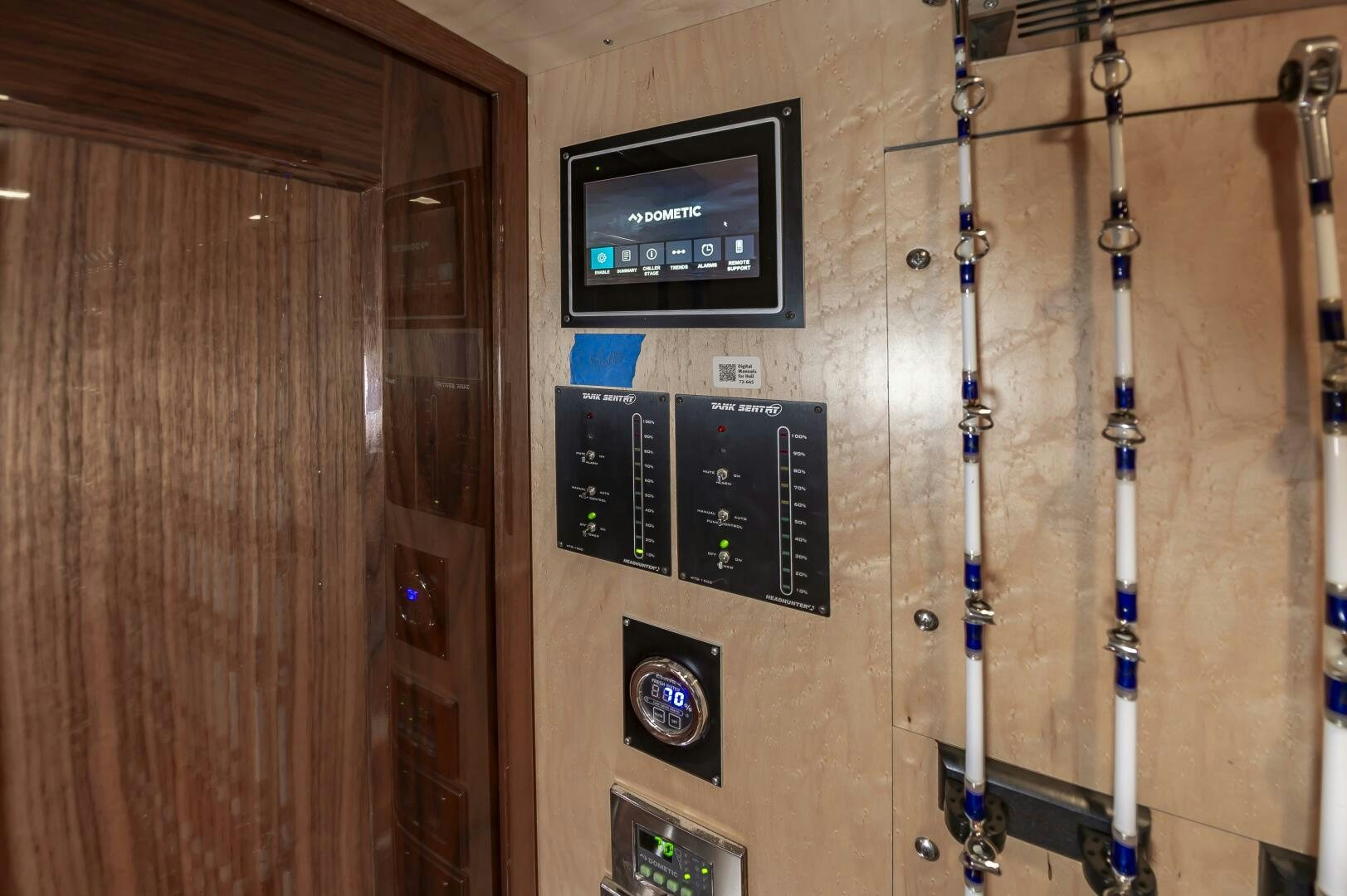 a wall with a sign and a sword and a shield aboard MERCENARIA Yacht for Sale