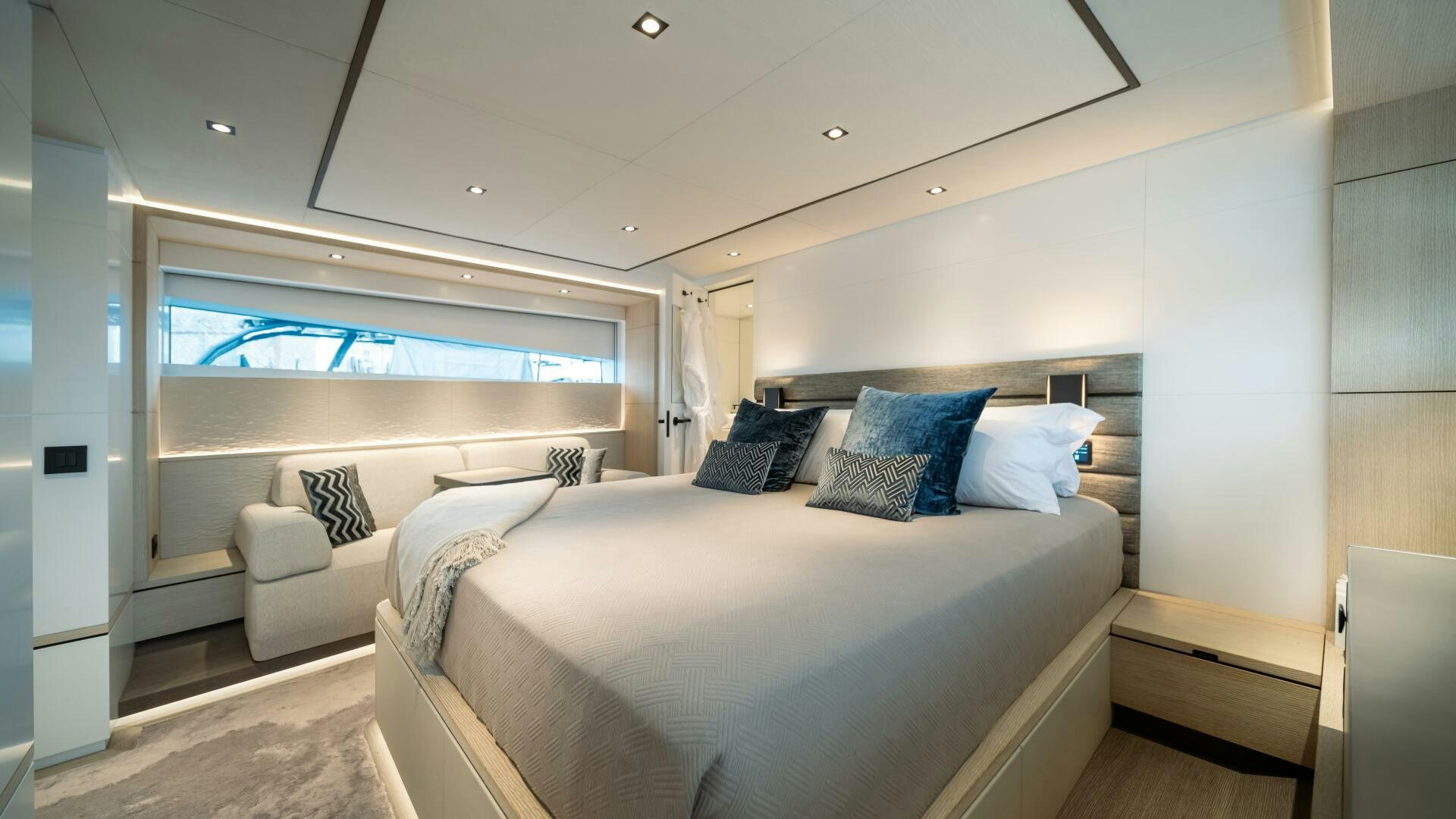 a room with a bed and a couch aboard FELLOWSHIP II Yacht for Sale