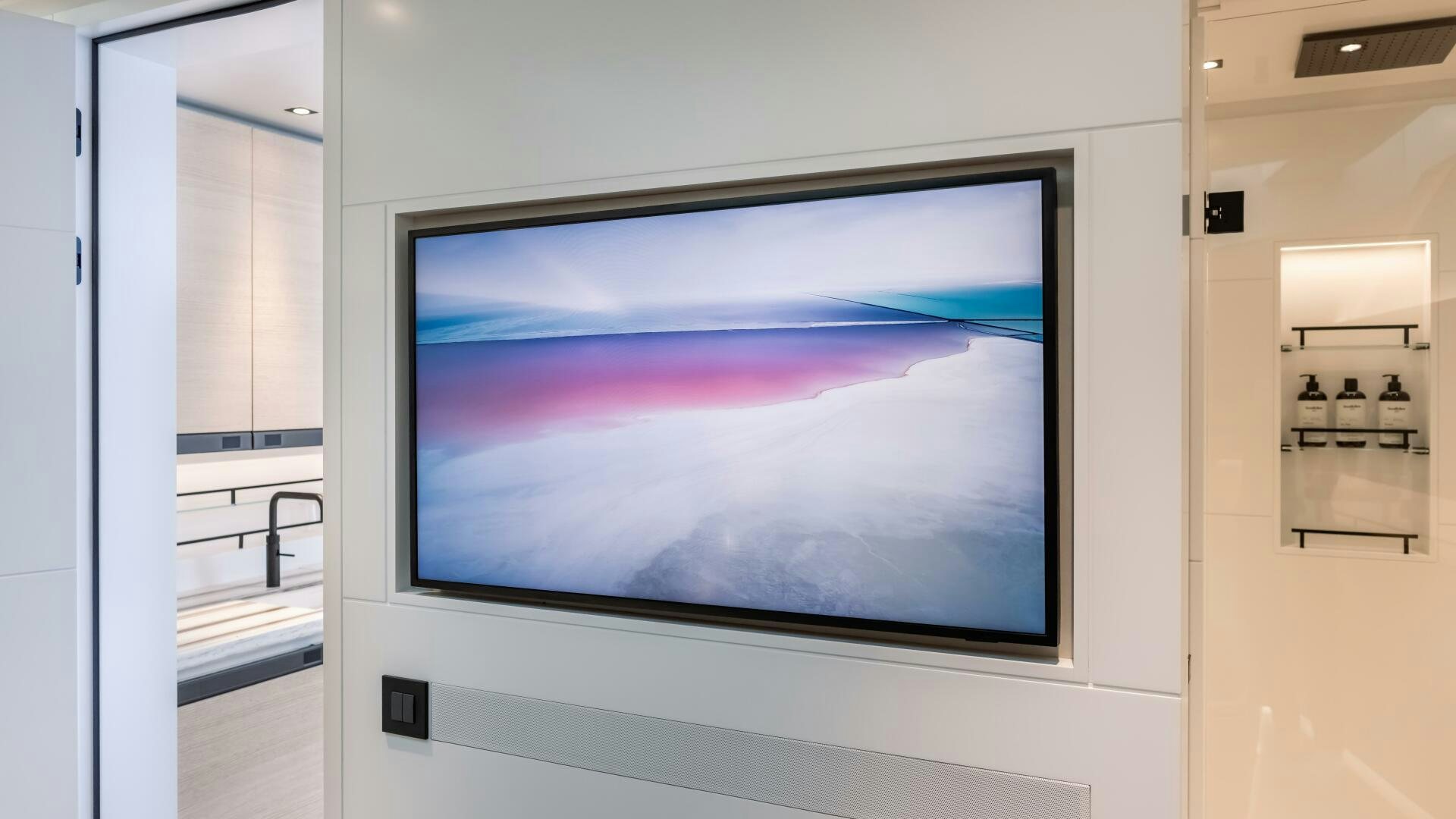 a large television screen aboard FELLOWSHIP II Yacht for Sale