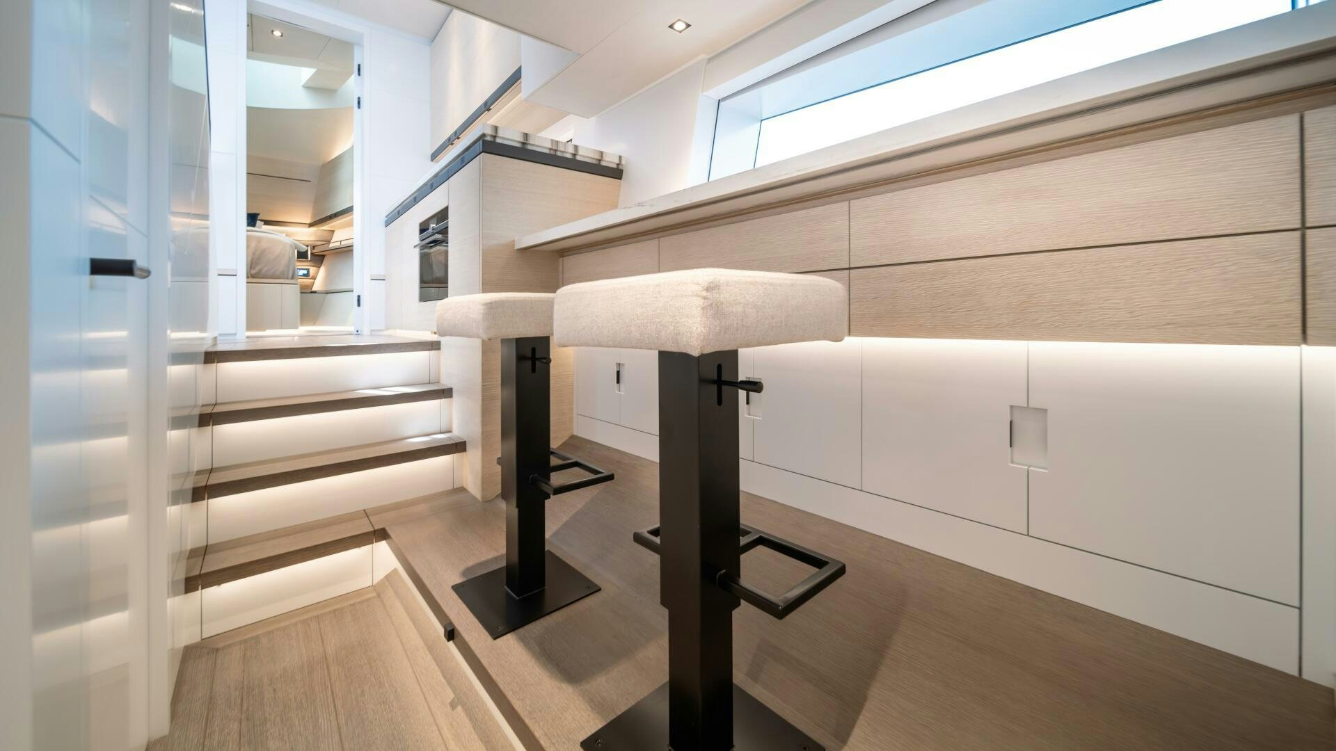 a room with a table and a chair aboard FELLOWSHIP II Yacht for Sale