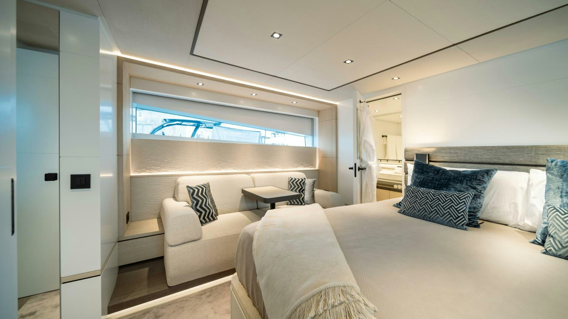 a room with a bed and a couch aboard FELLOWSHIP II Yacht for Sale