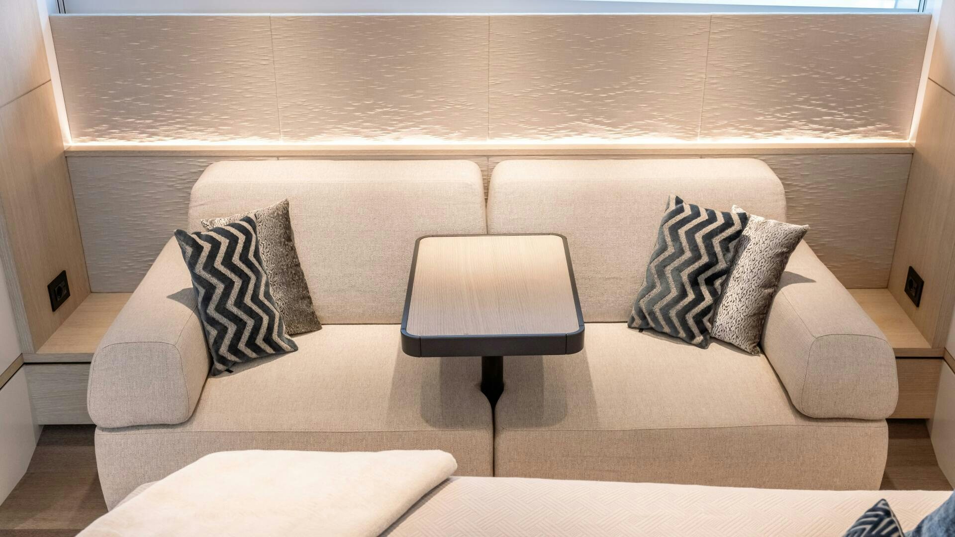 a couch with pillows and chairs aboard FELLOWSHIP II Yacht for Sale