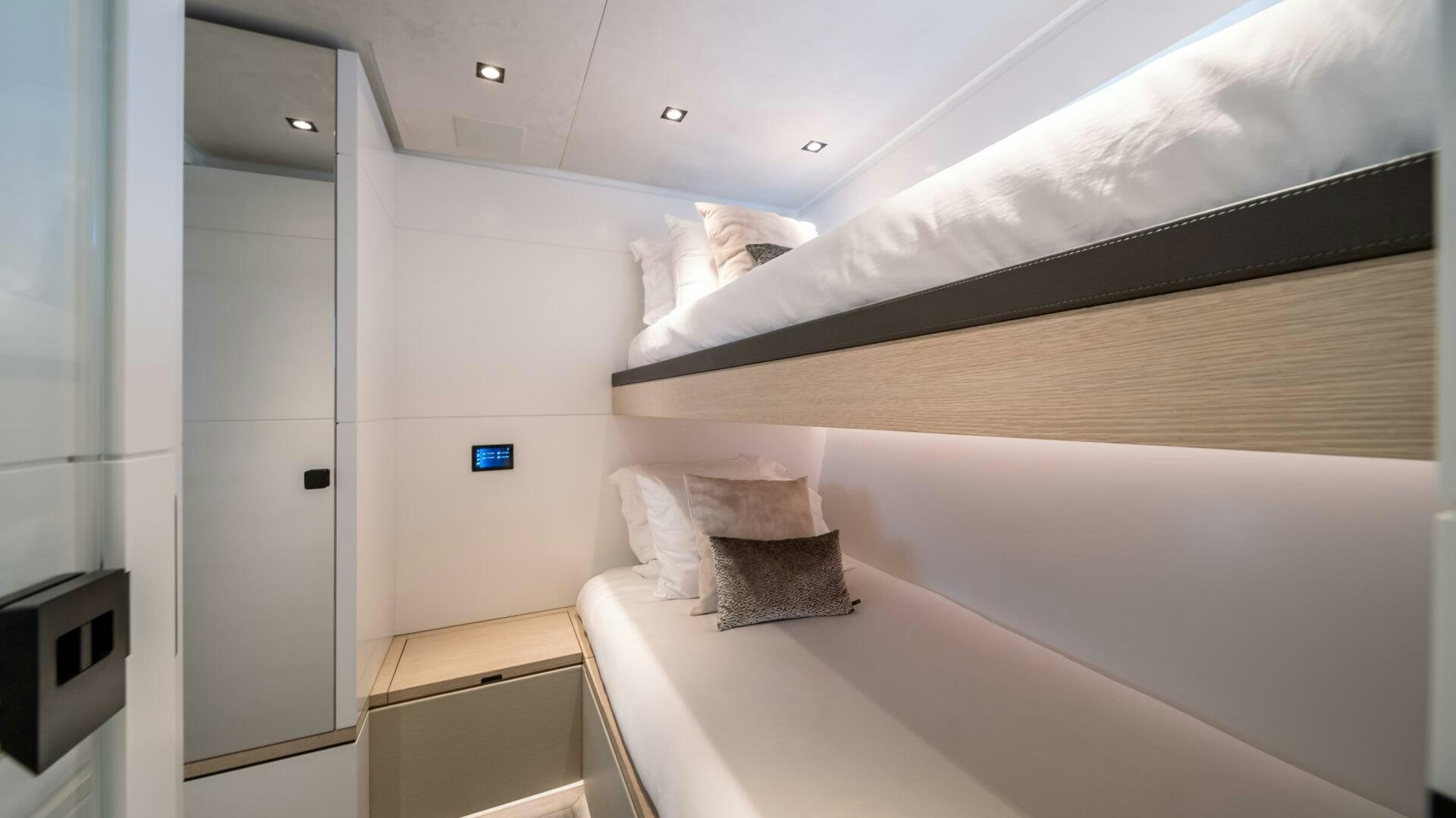 a room with a bed and a television aboard FELLOWSHIP II Yacht for Sale
