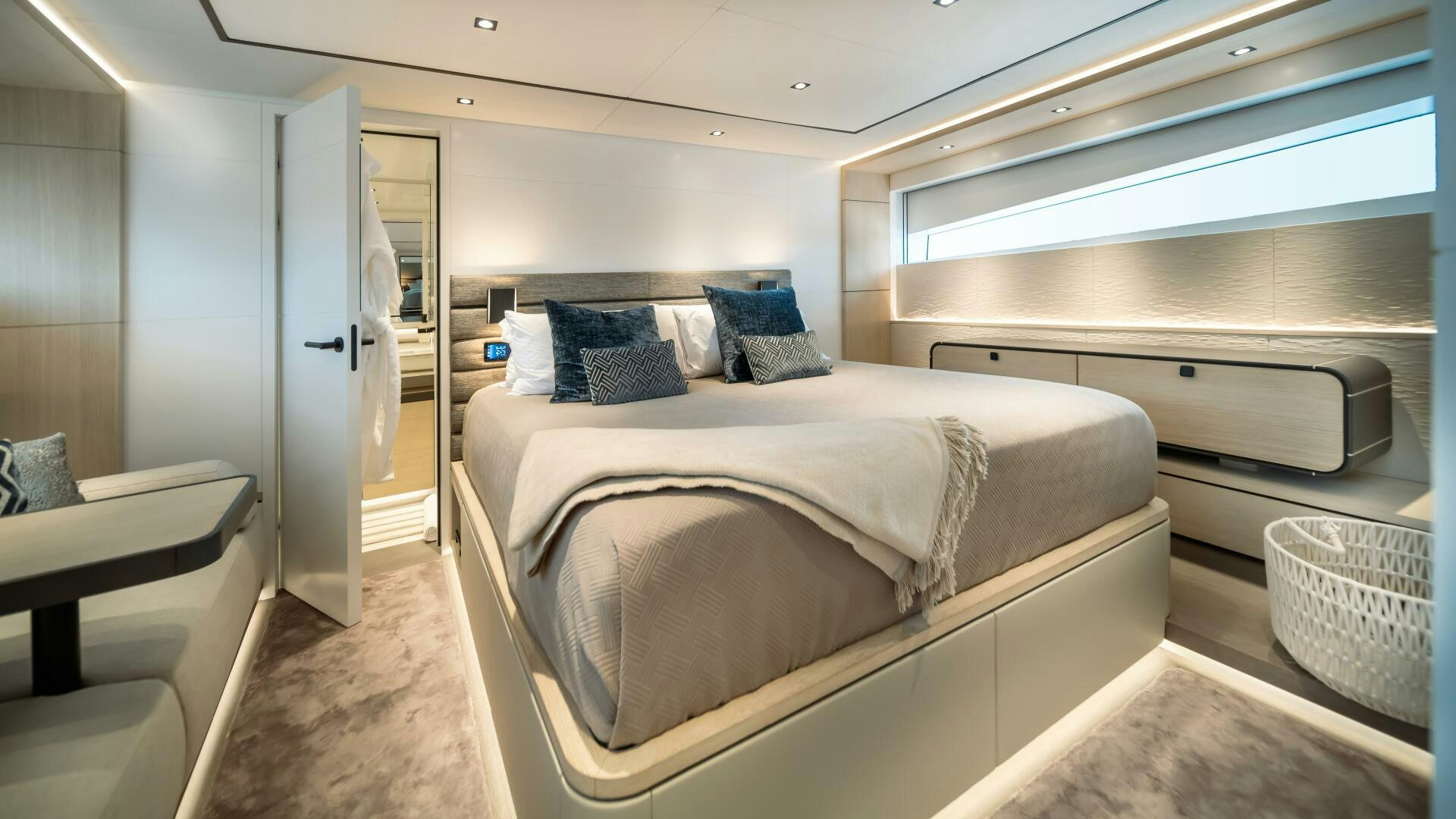 a room with a bed and a chair aboard FELLOWSHIP II Yacht for Sale