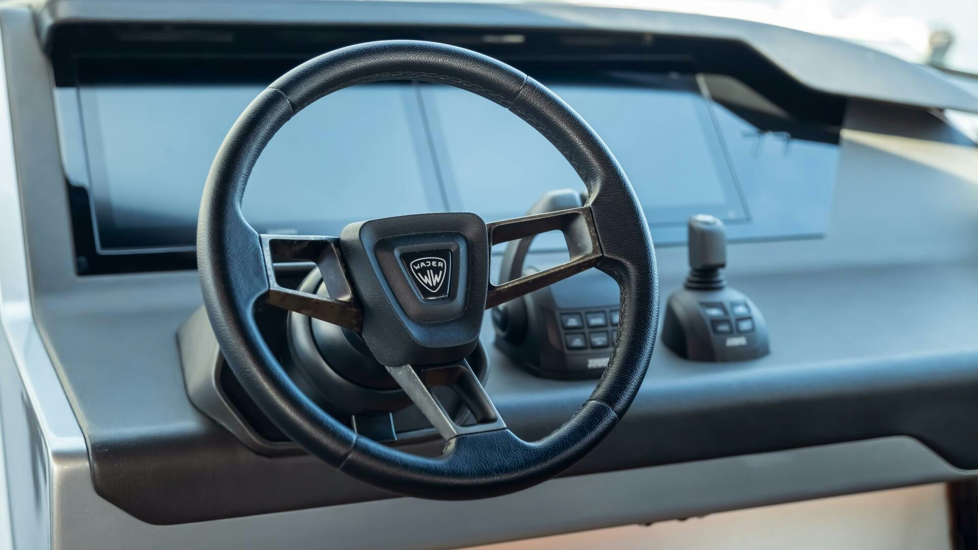 a steering wheel and dashboard of a car aboard FELLOWSHIP II Yacht for Sale