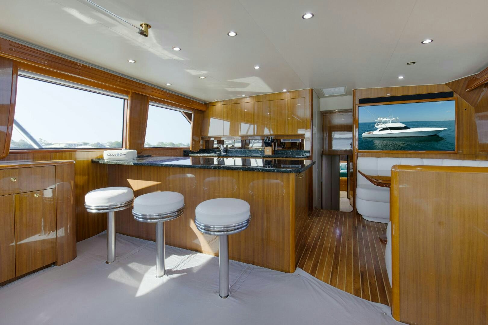 a kitchen with stools and stools aboard JESSI SUE Yacht for Sale