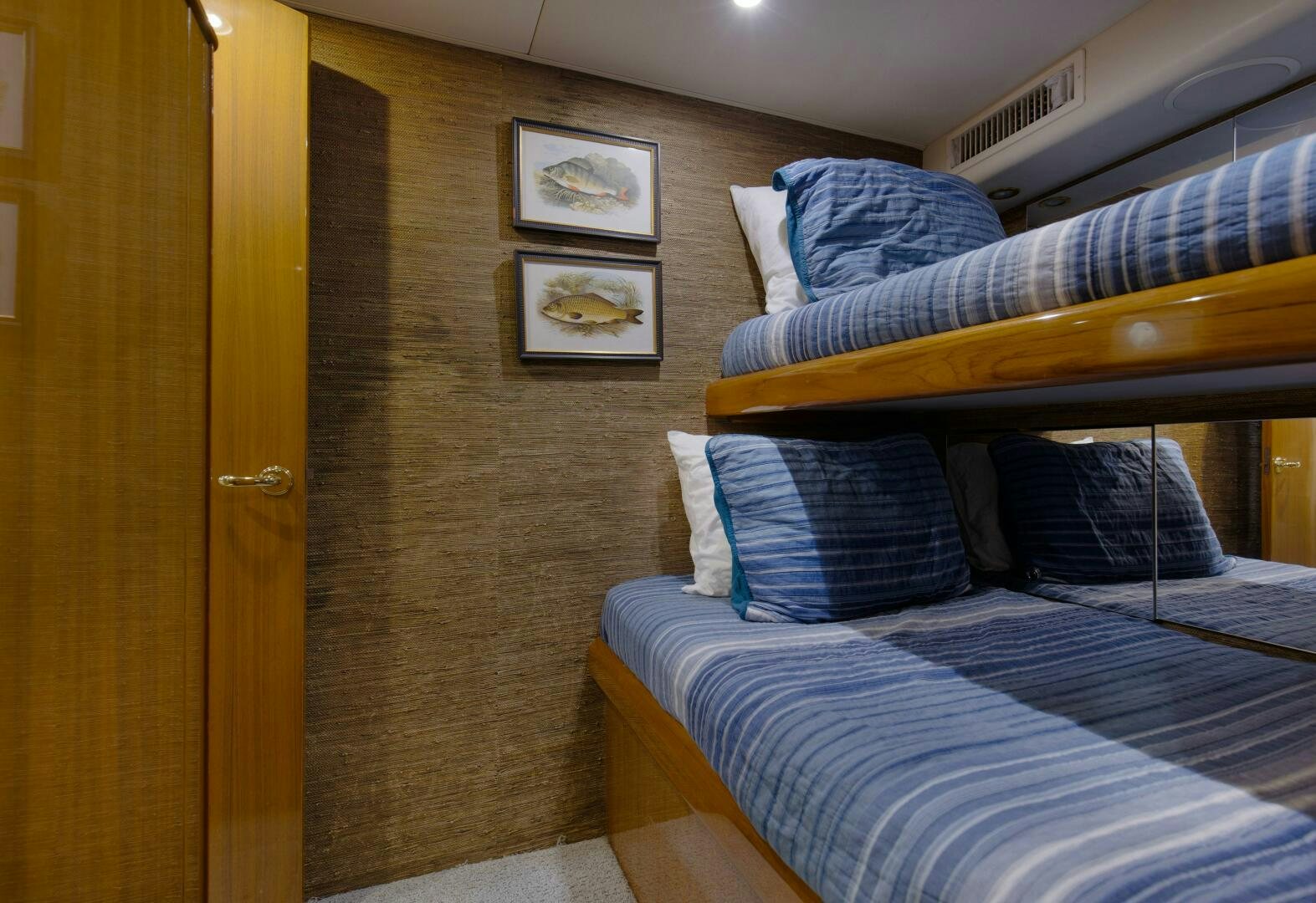 a room with a bed and a couch aboard JESSI SUE Yacht for Sale