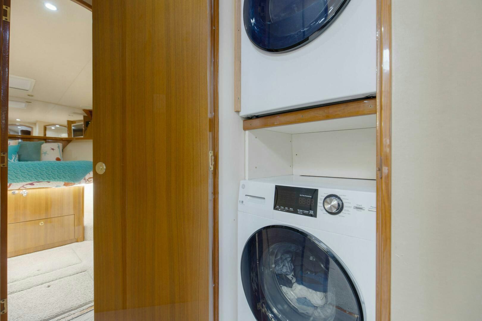 a washing machine in a room aboard JESSI SUE Yacht for Sale