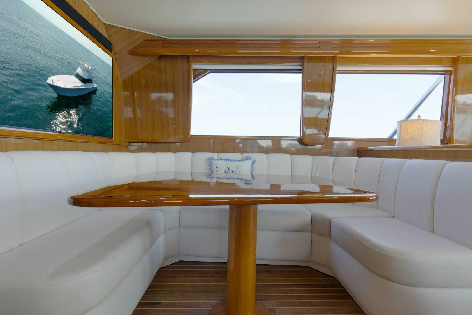 a room with a table and a couch aboard JESSI SUE Yacht for Sale