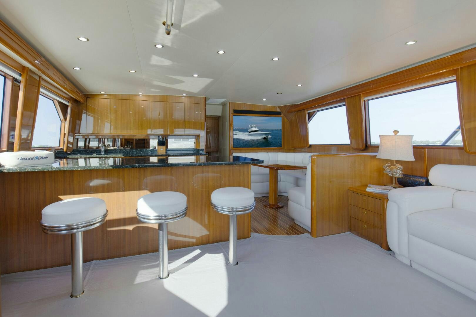 a large kitchen with a bar and bar aboard JESSI SUE Yacht for Sale
