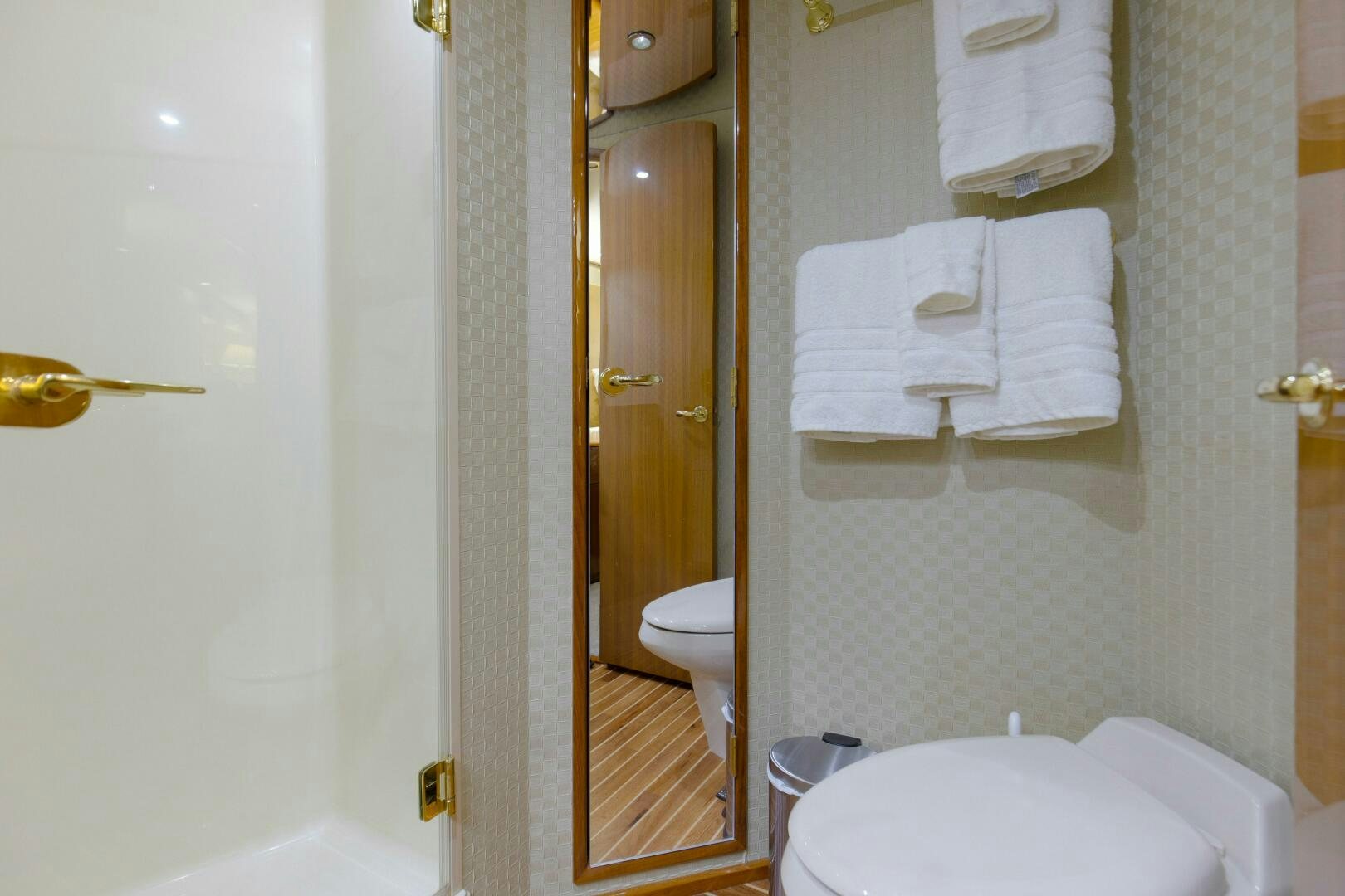 a bathroom with a toilet and a sink aboard JESSI SUE Yacht for Sale