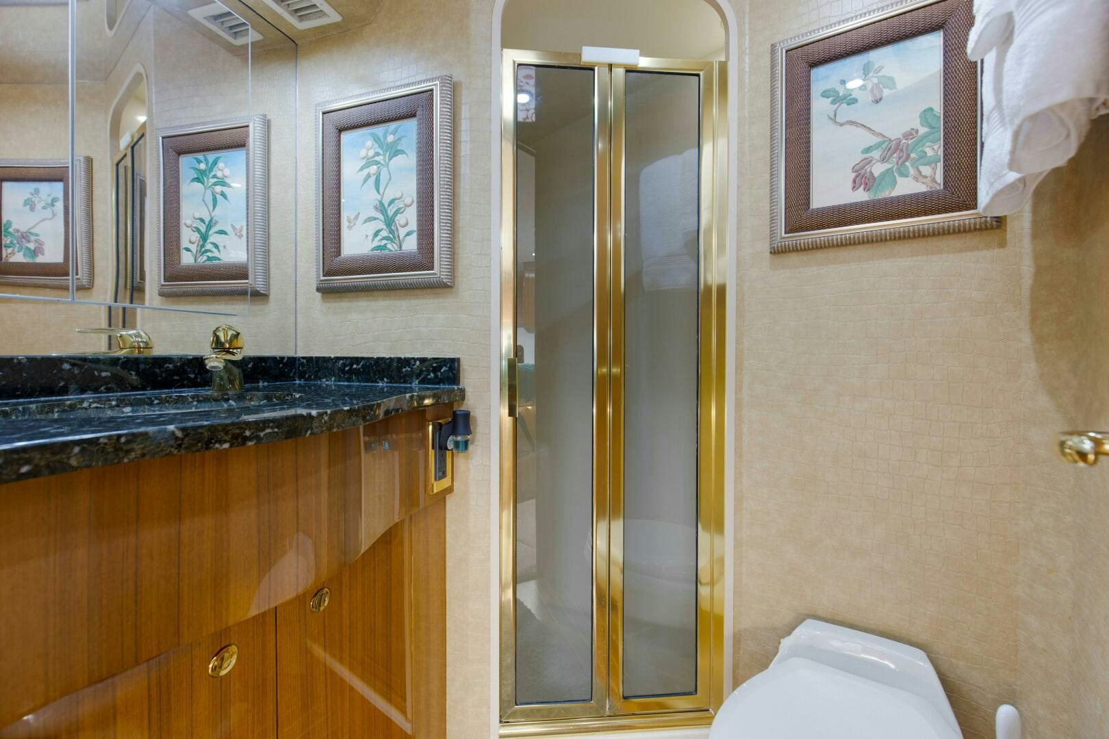 a bathroom with a glass shower aboard JESSI SUE Yacht for Sale