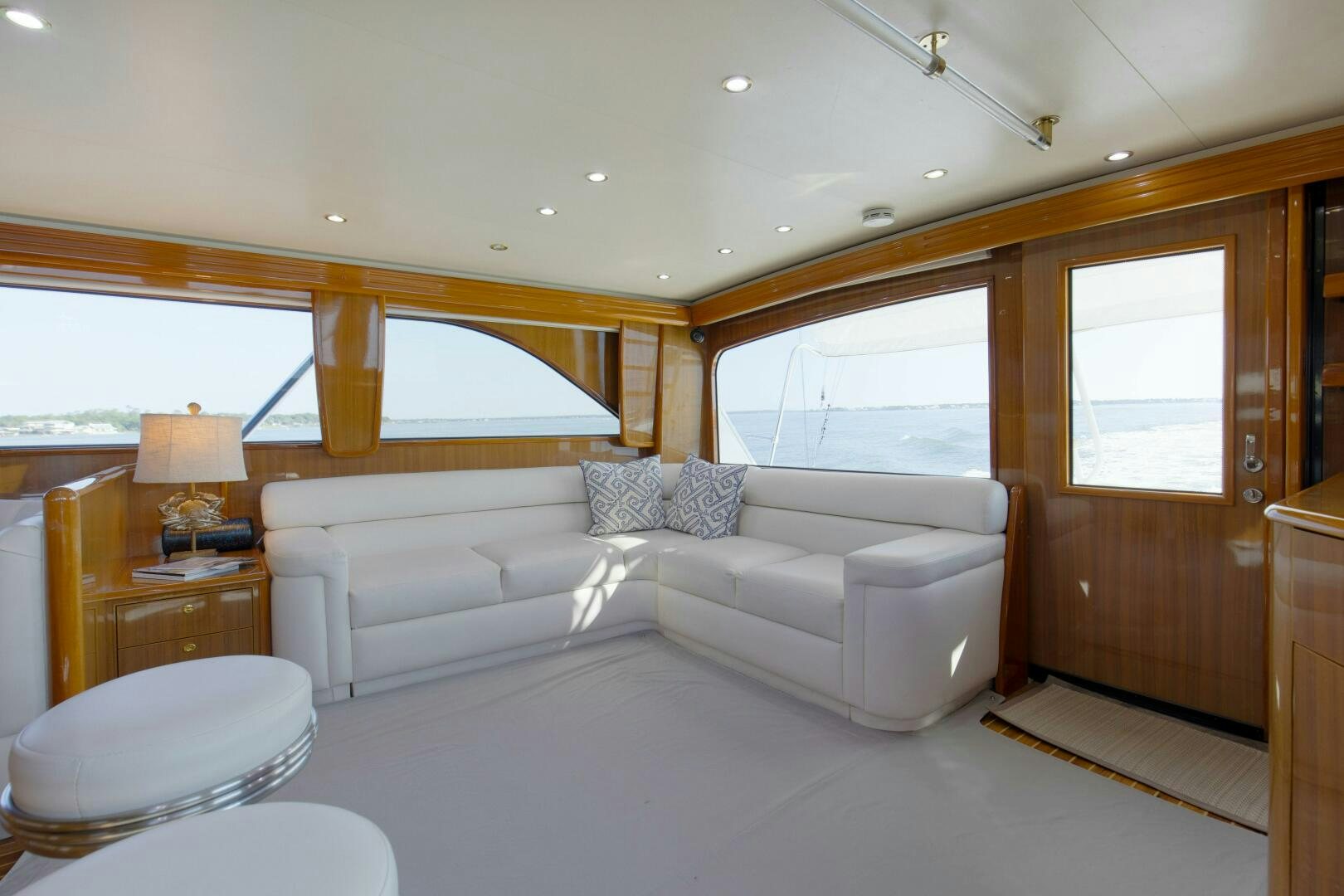 a living room with a couch and a window aboard JESSI SUE Yacht for Sale