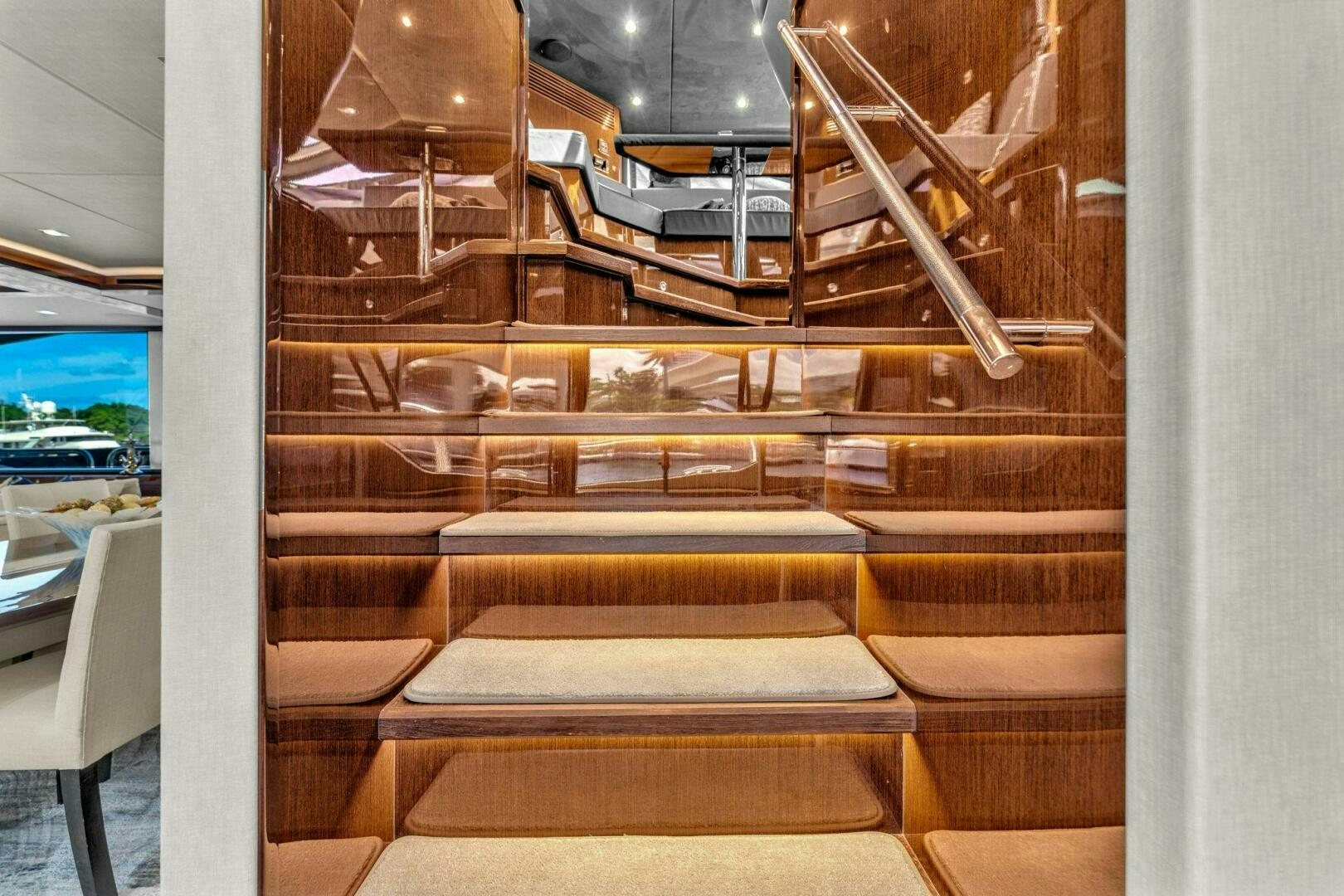 a room with a staircase and a window aboard KARILLIAN & COMPANY Yacht for Sale