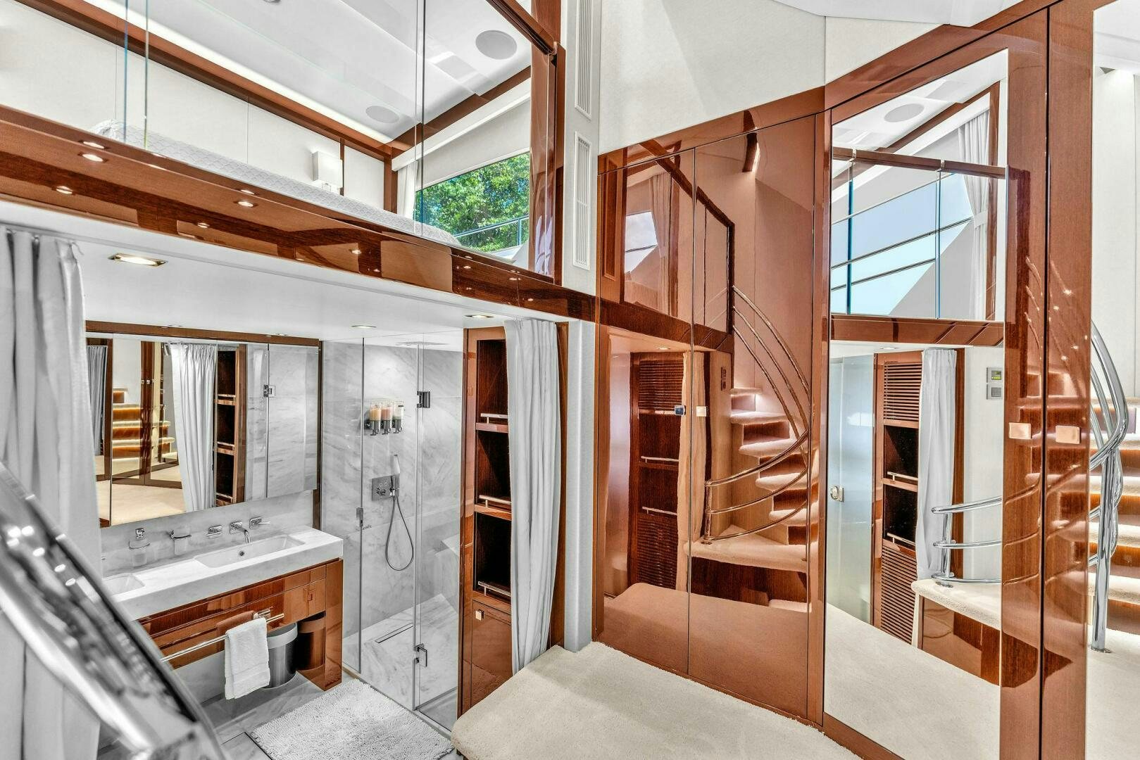 a room with wooden stairs aboard KARILLIAN & COMPANY Yacht for Sale