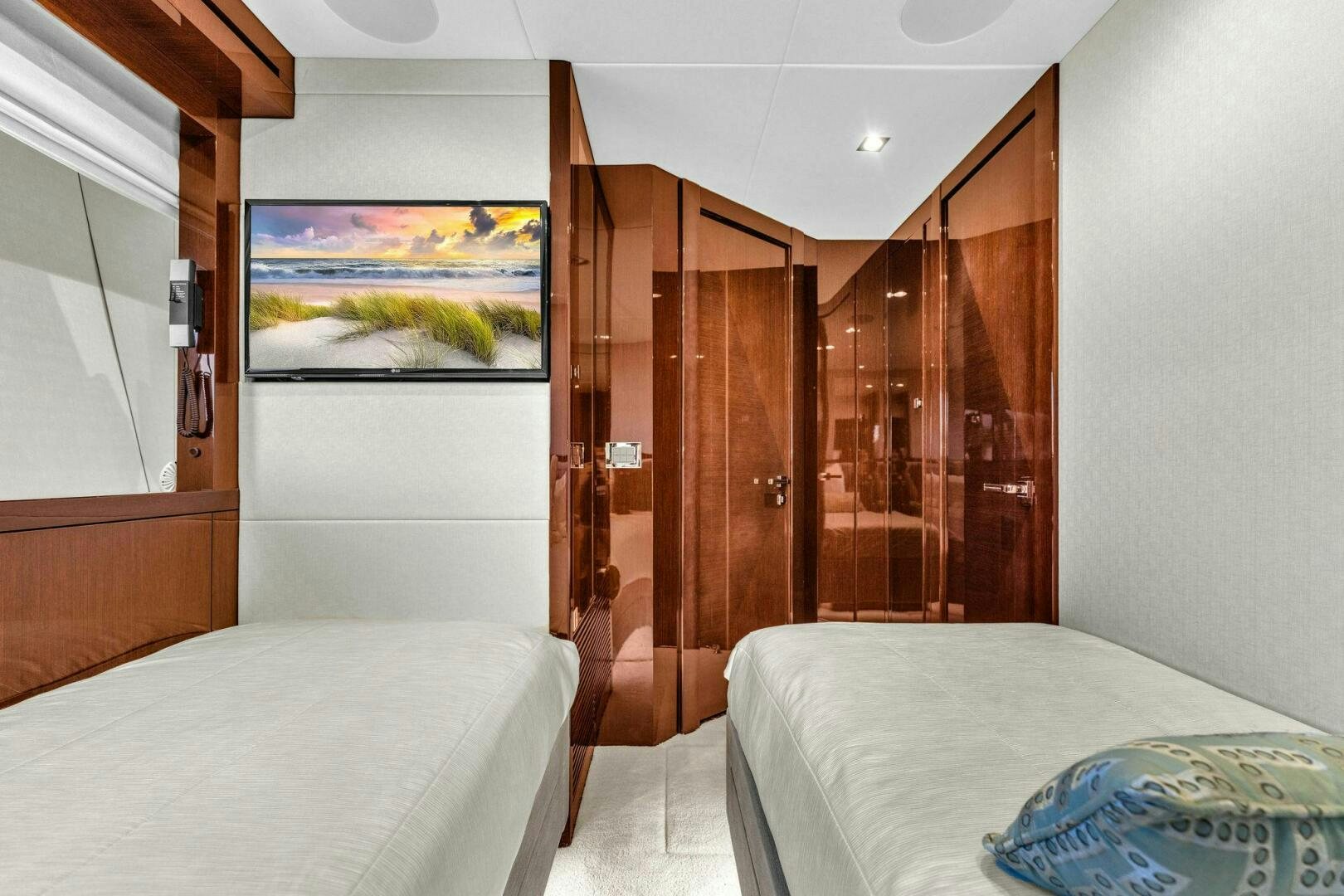 a room with a bed and a wood door aboard KARILLIAN & COMPANY Yacht for Sale