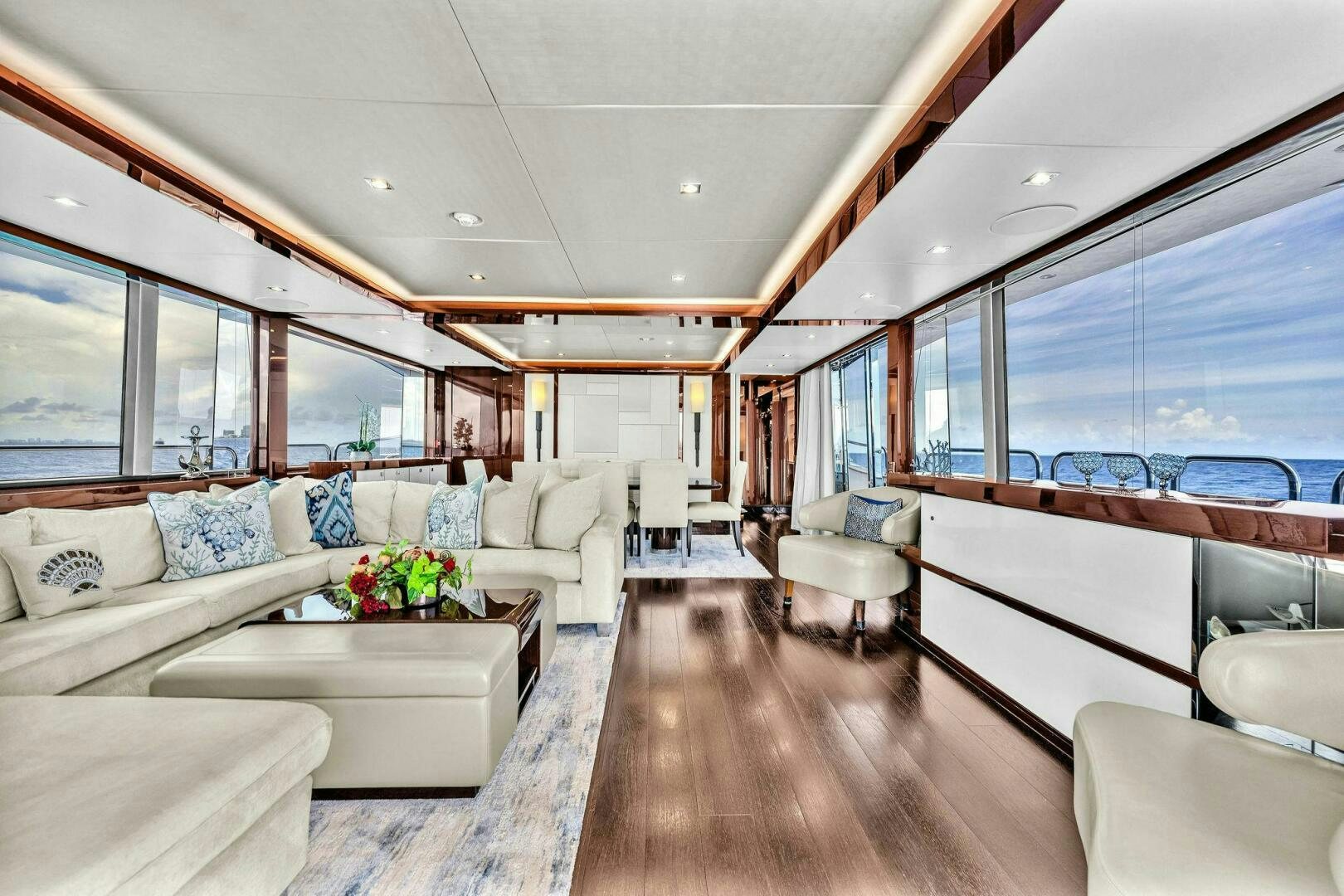a living room with a large window aboard KARILLIAN & COMPANY Yacht for Sale