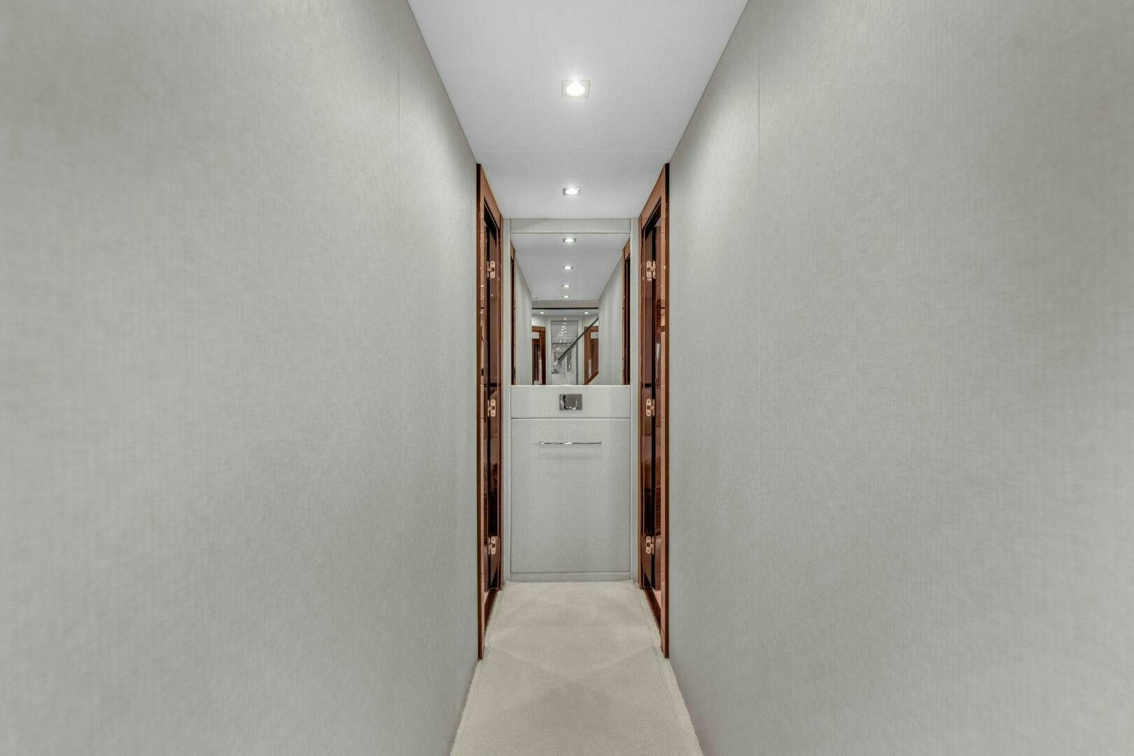 a hallway with a door aboard KARILLIAN & COMPANY Yacht for Sale