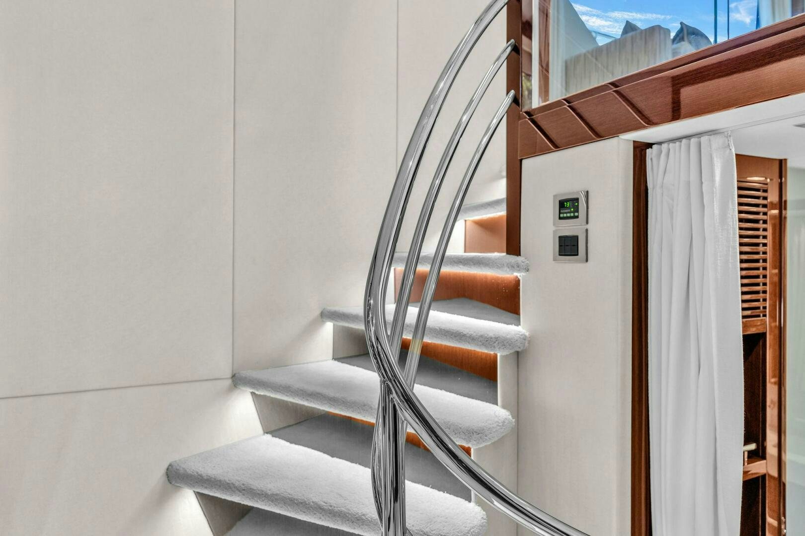 a white staircase with a railing aboard KARILLIAN & COMPANY Yacht for Sale