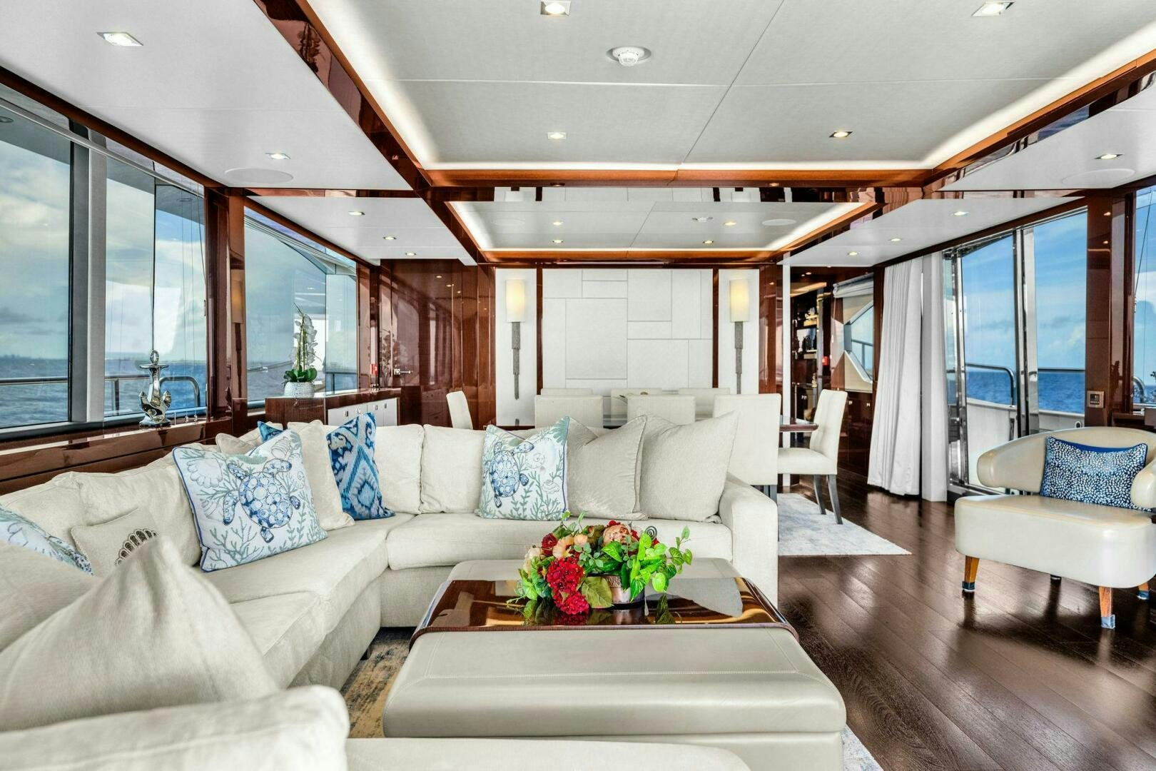 a living room with a large window aboard KARILLIAN & COMPANY Yacht for Sale