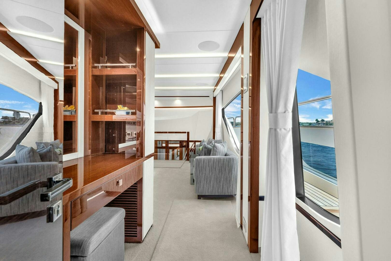 a room with a staircase and a window aboard KARILLIAN & COMPANY Yacht for Sale